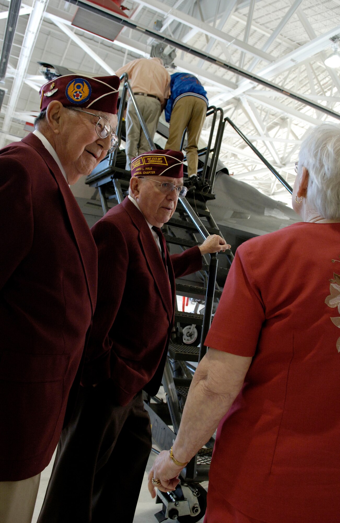 LANGLEY AIR FORCE BASE, Va. -- Former prisoners of war Mr. Edward Wallace and Mr. Wayne Porter wait to take a look into the cockpit of an F-22 Raptor during a tour of Langley as part of POW/MIA Recognition Day activities on Sept. 19. A group of World War II, Korean, and Vietnam wars POWs and their families were invited to a special luncheon, a static display of an F-22, the ceremony for the first term airmen center graduates, and a special retreat ceremony in the afternoon. (U.S. Air Force photo/Airman Rebecca Montez)