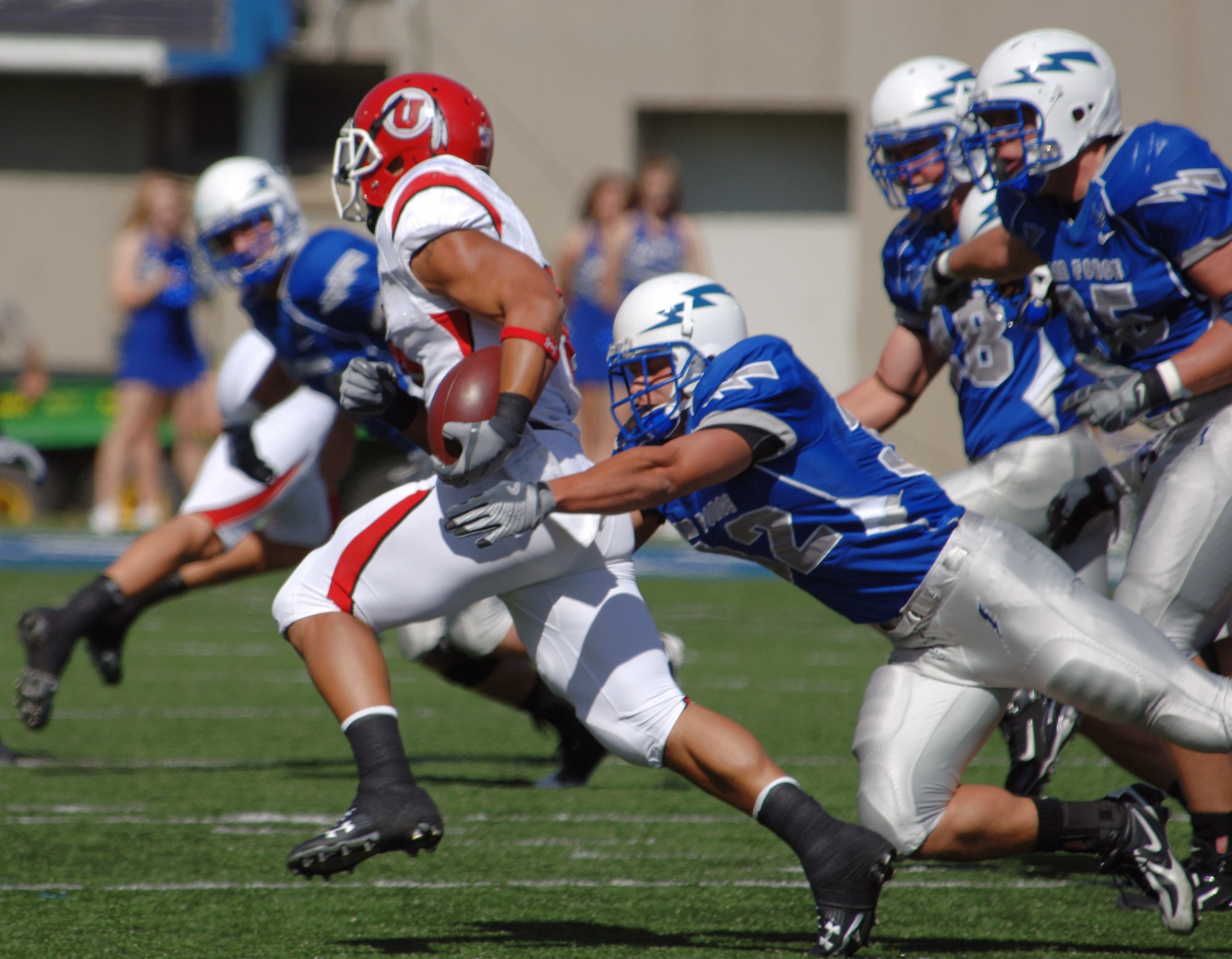 U.S. Air Force Academy senior linebacker Hunter Altman tackles Utah running back Darrell Mack Sept. 20 at the Academy in Colorado. Altman ended the game with three tackles including this tackle for loss. (U.S. Air Force photo/John Van Winkle) 
