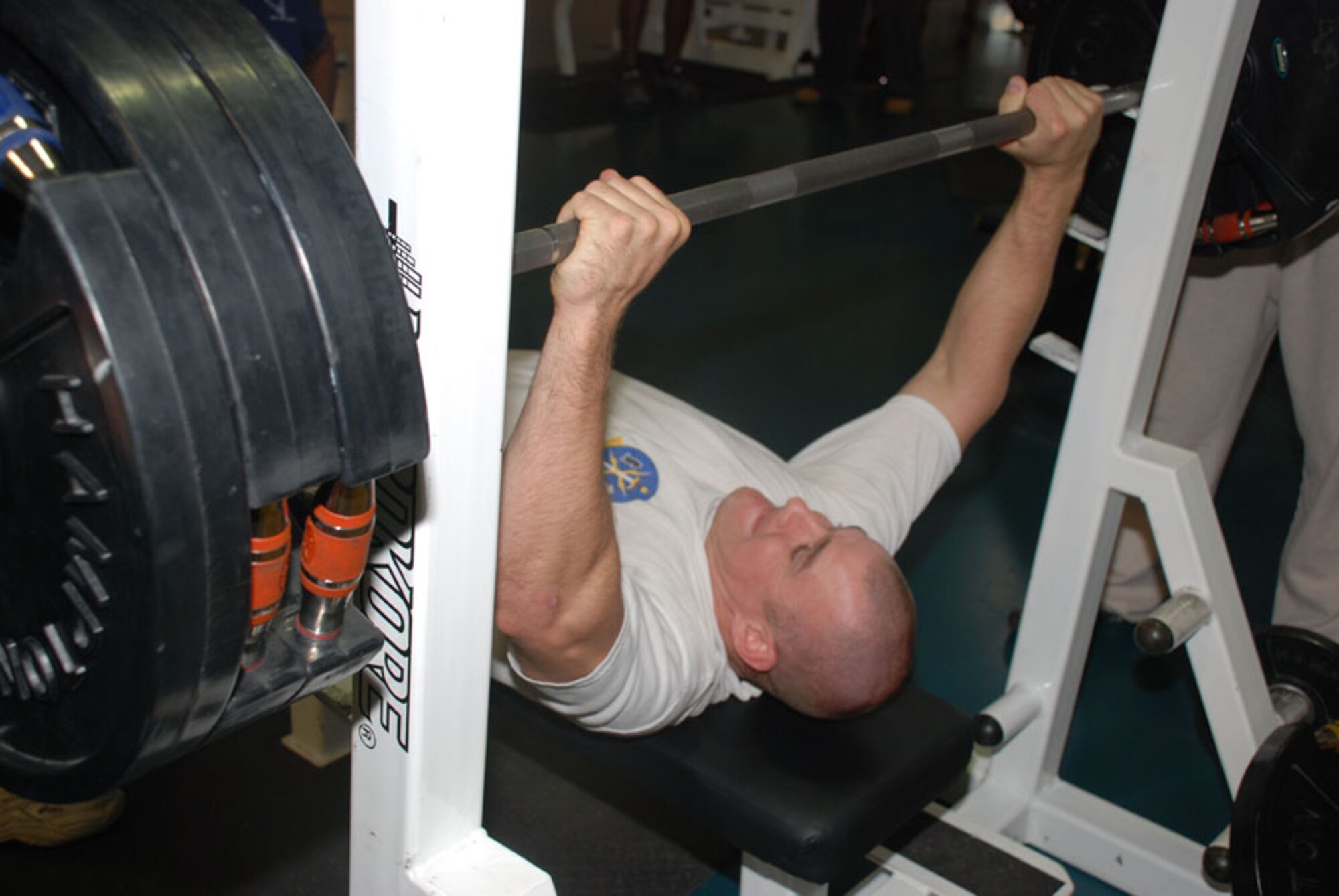 First Lt. Barrett Vandegrift, 37th Helicopter Squadron, lifts about 300 pounds during the bench press competition in the Independence Hall fitness center Sept. 9. There were three categories, under 185 pounds, 185 to 211 pounds and 212 plus.