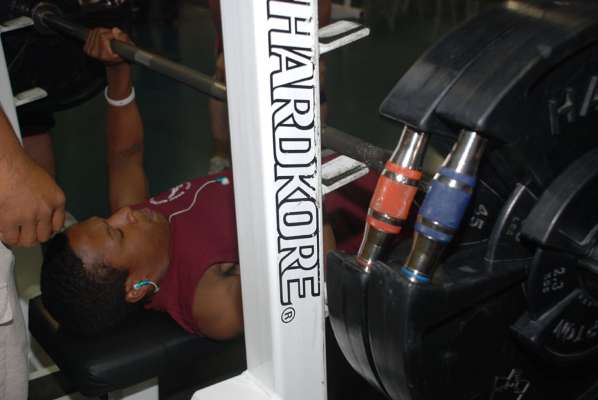 Airman 1st Class Ronald Paramore, 90th Missile Maintenance Squadron, lifts weights in the under 185 category.