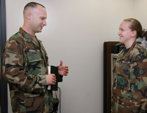 Chaplain (1st Lt.) Keith Saare talks with his new assistant, Staff Sgt. Vanessa Thomson, during the September Unit Training Assembly.  Chaplain Saare joined the 931st Air Refueling Group after five years as a trumpet player for the U.S. Army. (U.S. Air Force photo/Senior Airman Connor Burkhard)