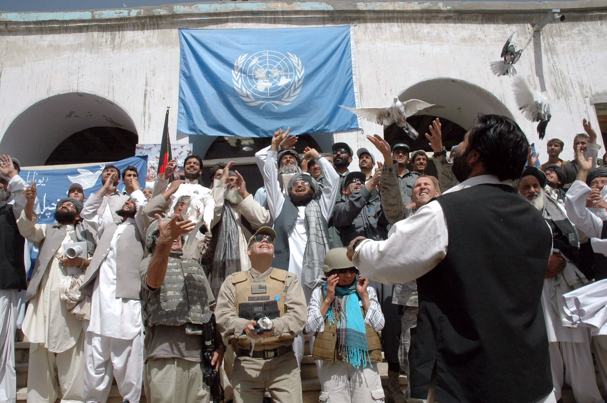 Zabul Governor Delbar Jan Arman (center), provincial authorities and Zabul Provincial Reconstruction Team personnel release doves Sept. 21 in celebration of the United Nations Day of Peace in Qalat, Afghanistan. The governor spoke to nearly 200 people about bringing peace to Afghanistan to ensure peace around the world. (U.S. Air Force photo/Capt. Jean Duggan) 
