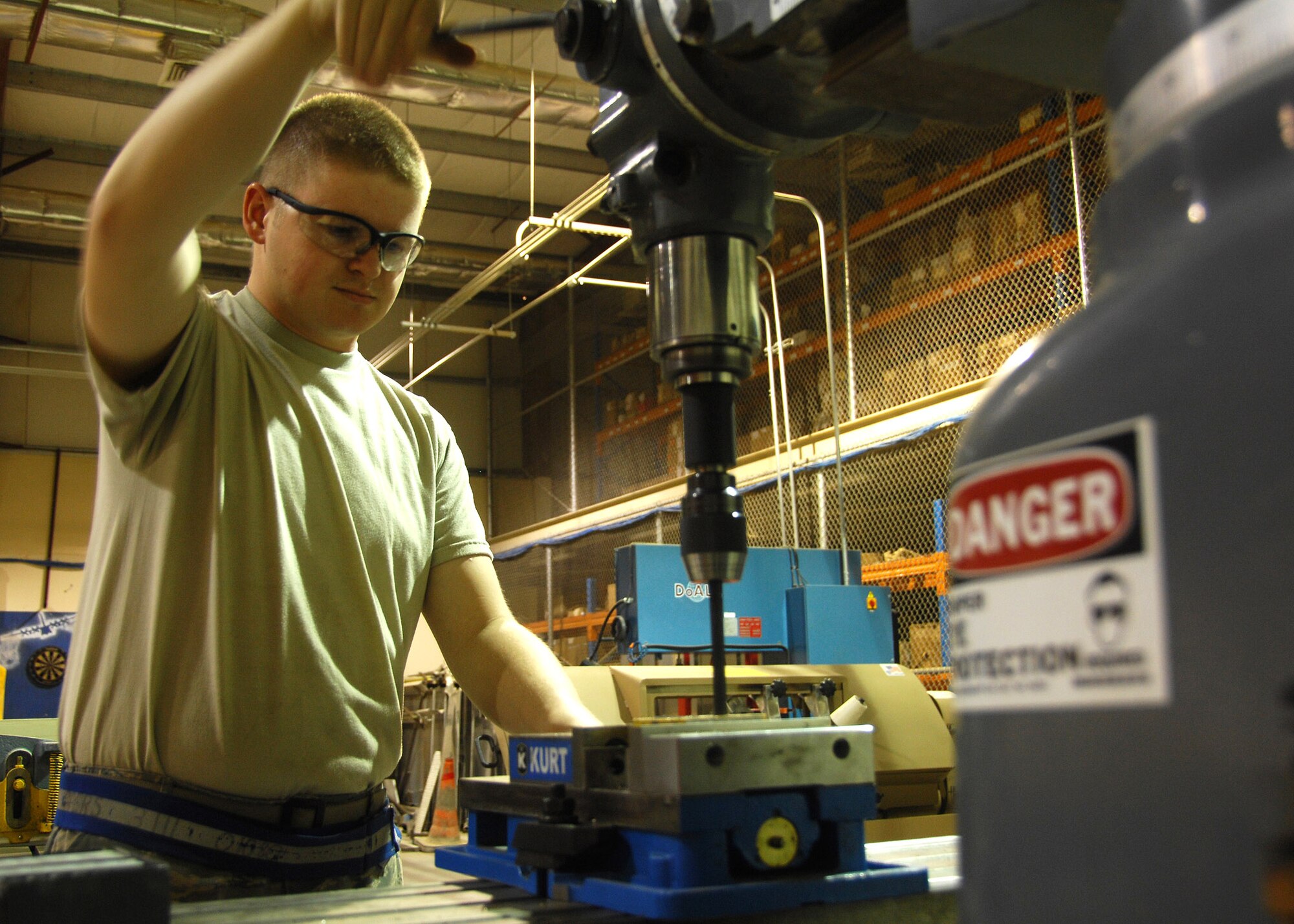 Senior Airman Timothy Jeffers drills holes into a fuel probe mounting bracket for a C-130 Hercules Sept. 17 at an air base in Southwest Asia. Members of the combat metals shop perform aircraft sheet metal fabrication, structural repairs and modifications for aircraft. Airman Jeffers is assigned to the 386th Expeditionary Maintenance Squadron combat metals section and deployed from Davis-Monthan Air Force Base, Ariz. (U.S. Air Force photo/Tech. Sgt. Raheem Moore) 

