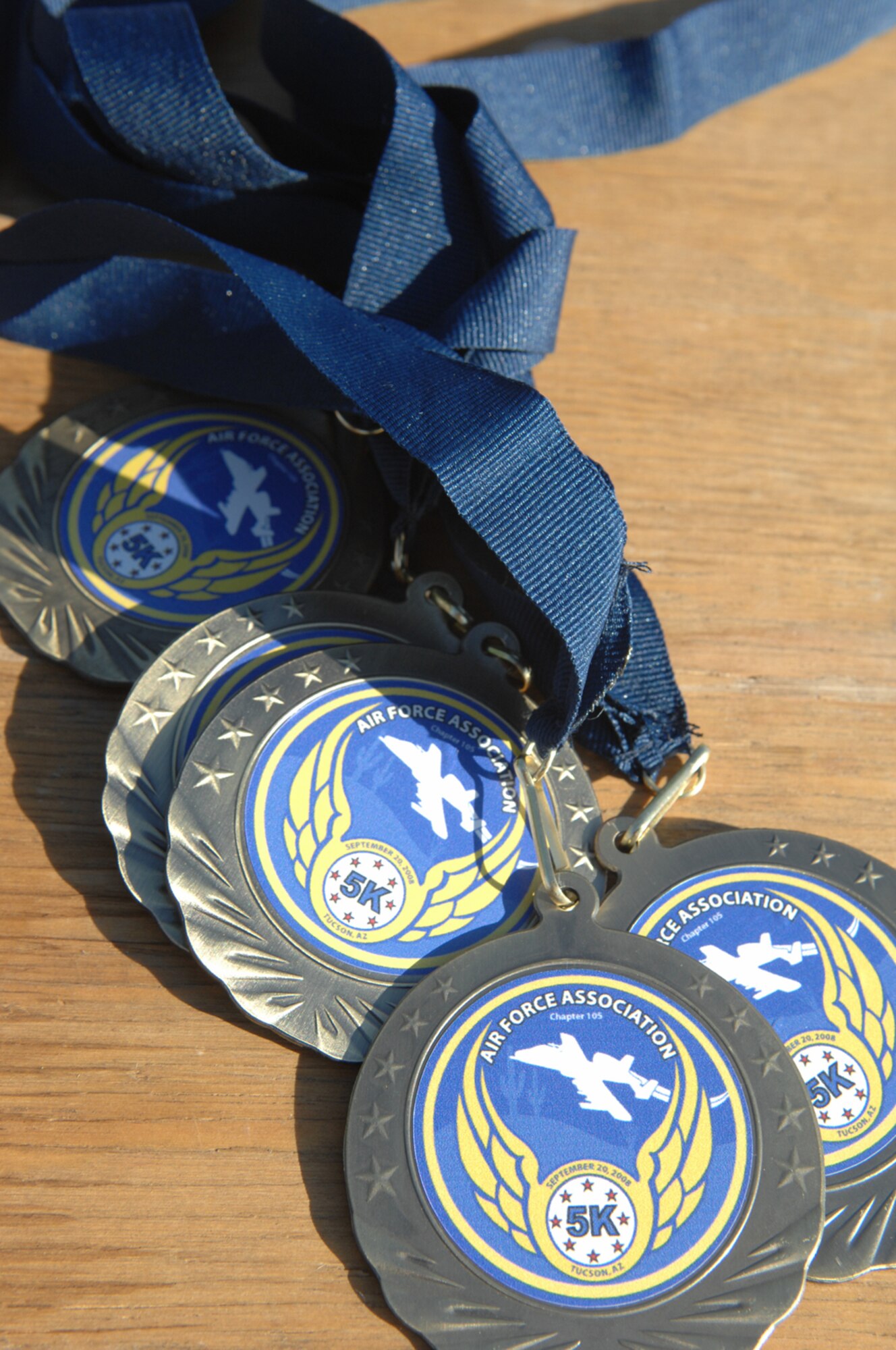 The Air Force Association held a 5K run Sept. 20 at the Pima Air and Space Museum to celebrate the Air Force's 61st birthday. The event, which was open to all age groups, kicked off at 7 a.m. Medallions were given to all finishers and trophies were given to the top finishers in each category. All proceeds went to the AFA. (U.S. Air Force photo by Staff Sgt. Valerie Smith)
