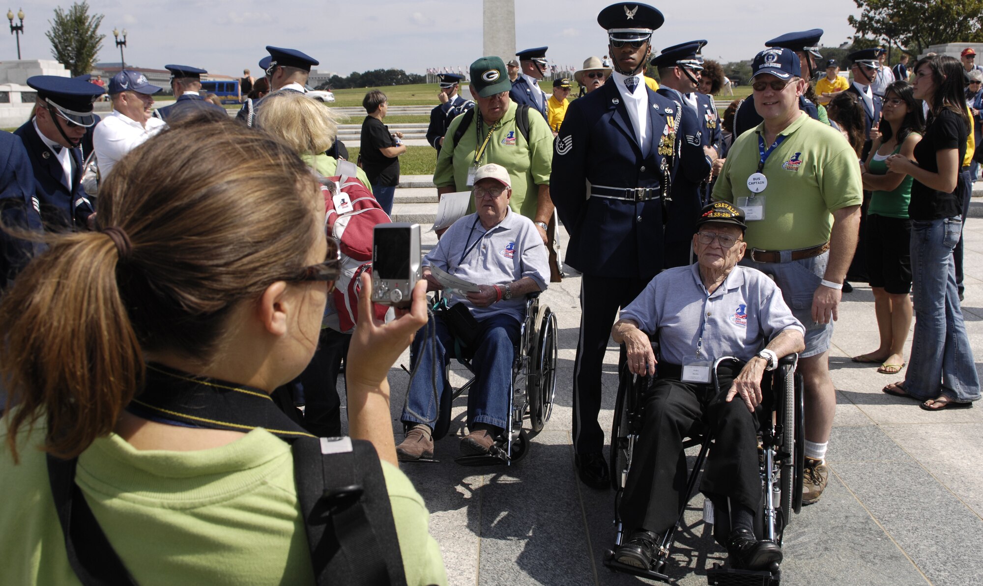 Tech. Sgt. Robert Jones, U.S. Air Force Honor Guard Drill Team, takes time to pose with a World War II veteran from the Veterans of Foreign Wars Iowa Honor Flight after a performance Sept. 17 at the World War II Memorial in Washington. The show was a tribute to World War II veterans in attendance and to honor those that lost their lives during World War II. (U.S. Air Force photo by Airman 1st Class Sean Adams)