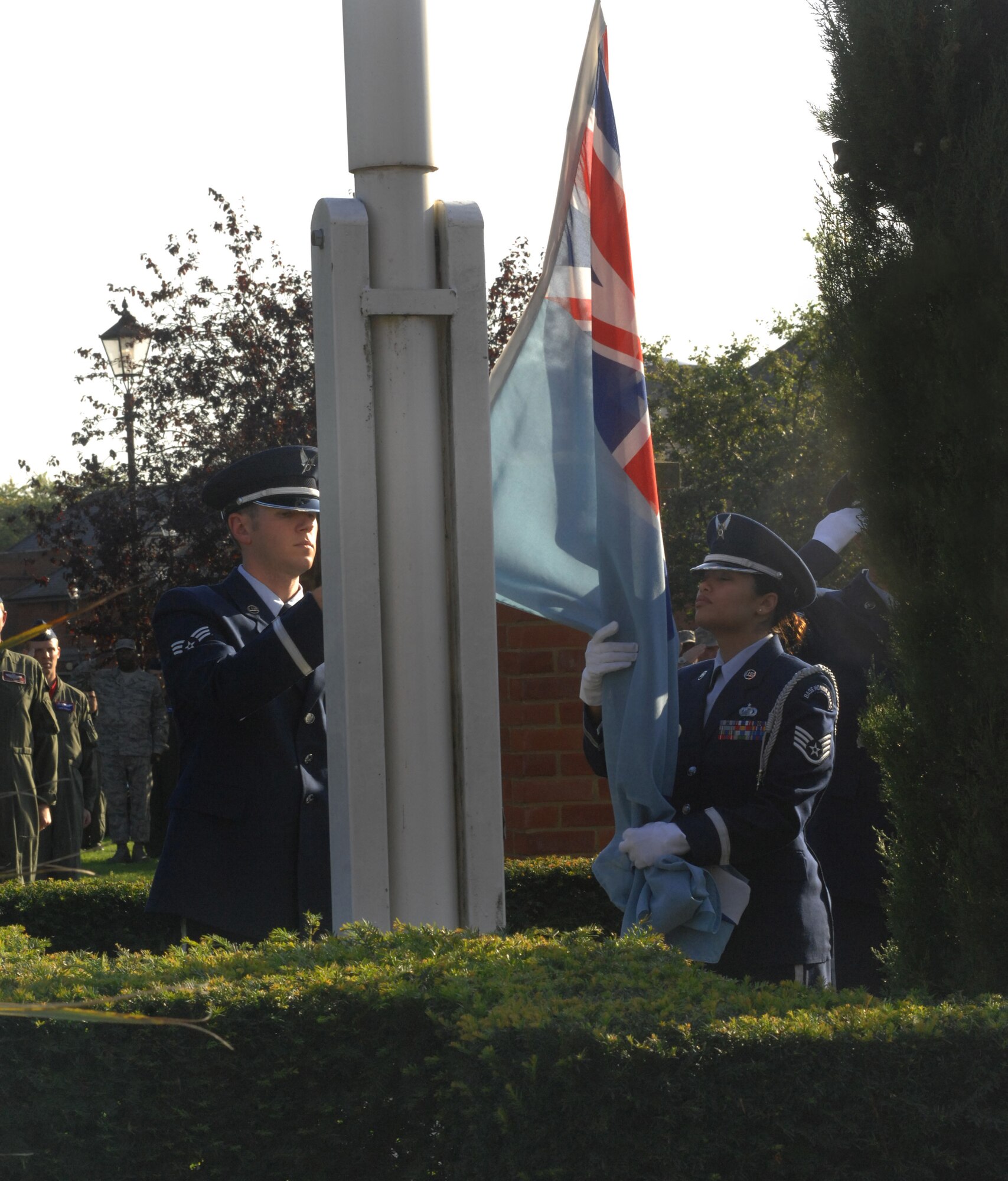 Members of the RAF Mildenhall Honor Guard lower the Royal Air Force flag during RAF Mildenhall's POW/MIA Remembrance Week retreat ceremony Sept. 19, 2008. (U.S Air Force Photo by Airman First Class Brad Smith)