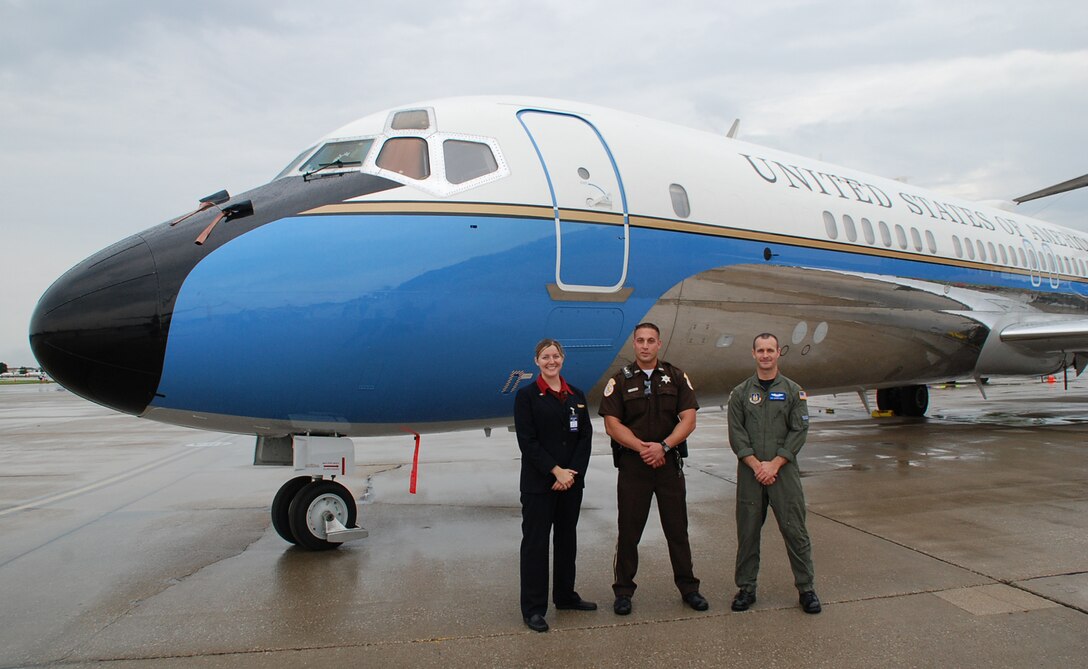 932nd Airlift Wing flight attendants stand by to meet the public at the 2008 Scott Air Force Base Airshow near Belleville, Ill.  Scott Air Force Base is one of the oldest, continuous-service Air Force installations. Its history spans the major evolutionary stages of the Air Force: Aviation Section; Signal Corps; Army Air Service; Army Air Corps; Army Air Forces; and Air Force. It was named Scott Field on July 20, 1917, after Corporal Frank S. Scott, the first enlisted person to be killed in an airplane crash.Even with some rain, big crowds came out to meet the aircrews and see the Air Force Reserve Command's C-9C (pictured here) and the C-40C, which are both used for distinguished visitor missions.  (U.S. Air Force photo by Maj. Stan Paregien)