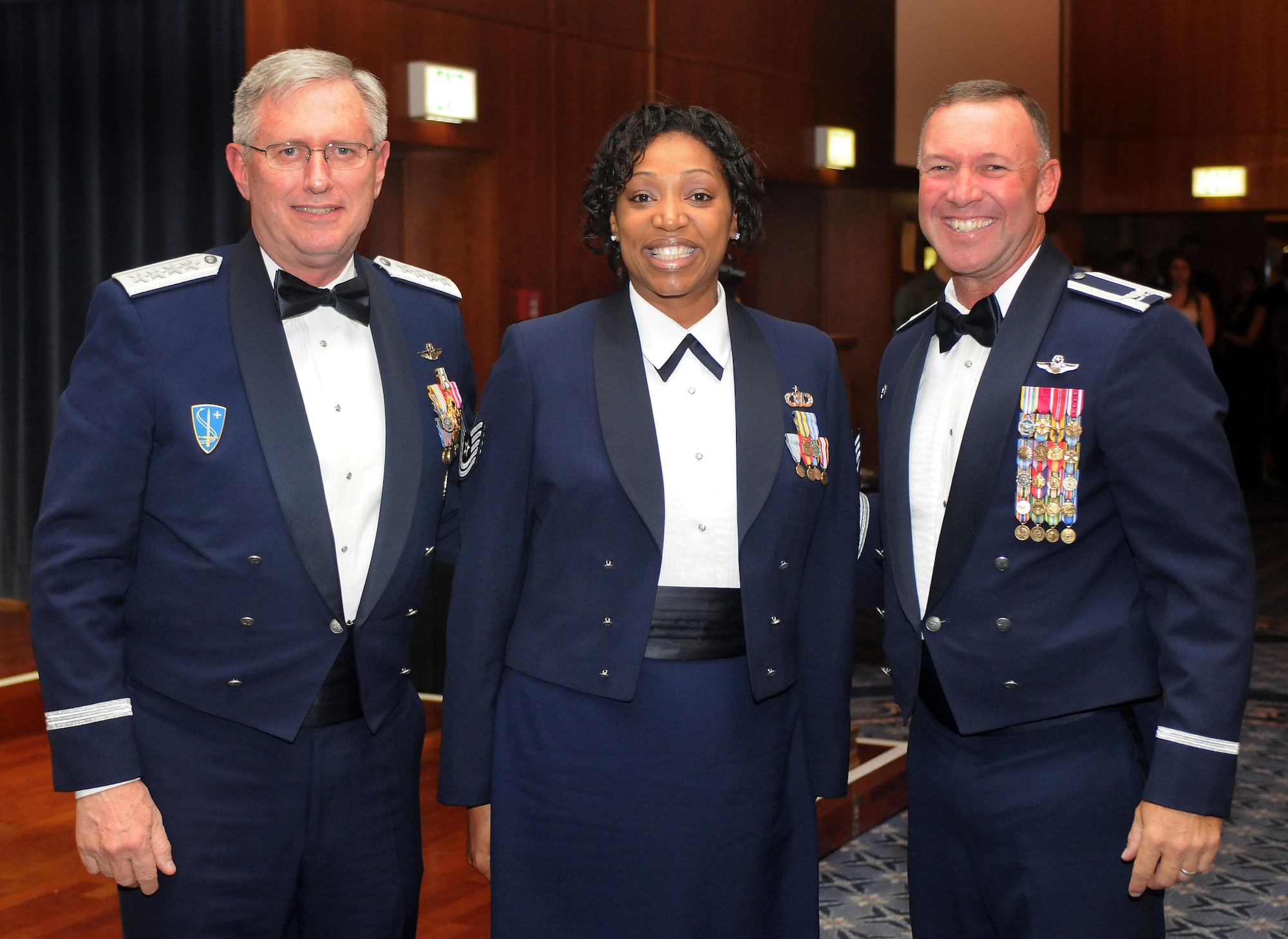 Gen. Roger A. Brady, U.S. Air Forces in Europe commander, poses for a photograph with newly-promoted Tech. Sgt. Monique N.  Dubose, 52nd Operations Support Squadron, and Col. Lee T. Wight, 52nd Fighter Wing commander. Sergeant Dubose was awarded her technical sergeant stripes during a surprise Stripes for Exceptional Performers promotion during the Air Force Ball held on Spangdahlem Air Base, Germany, Sept. 20, 2008. The 2008 Air Force Ball commemorates the Air Force’s 61st birthday. (U.S. Air Force photo by Master Sgt. Alexander Ray)
