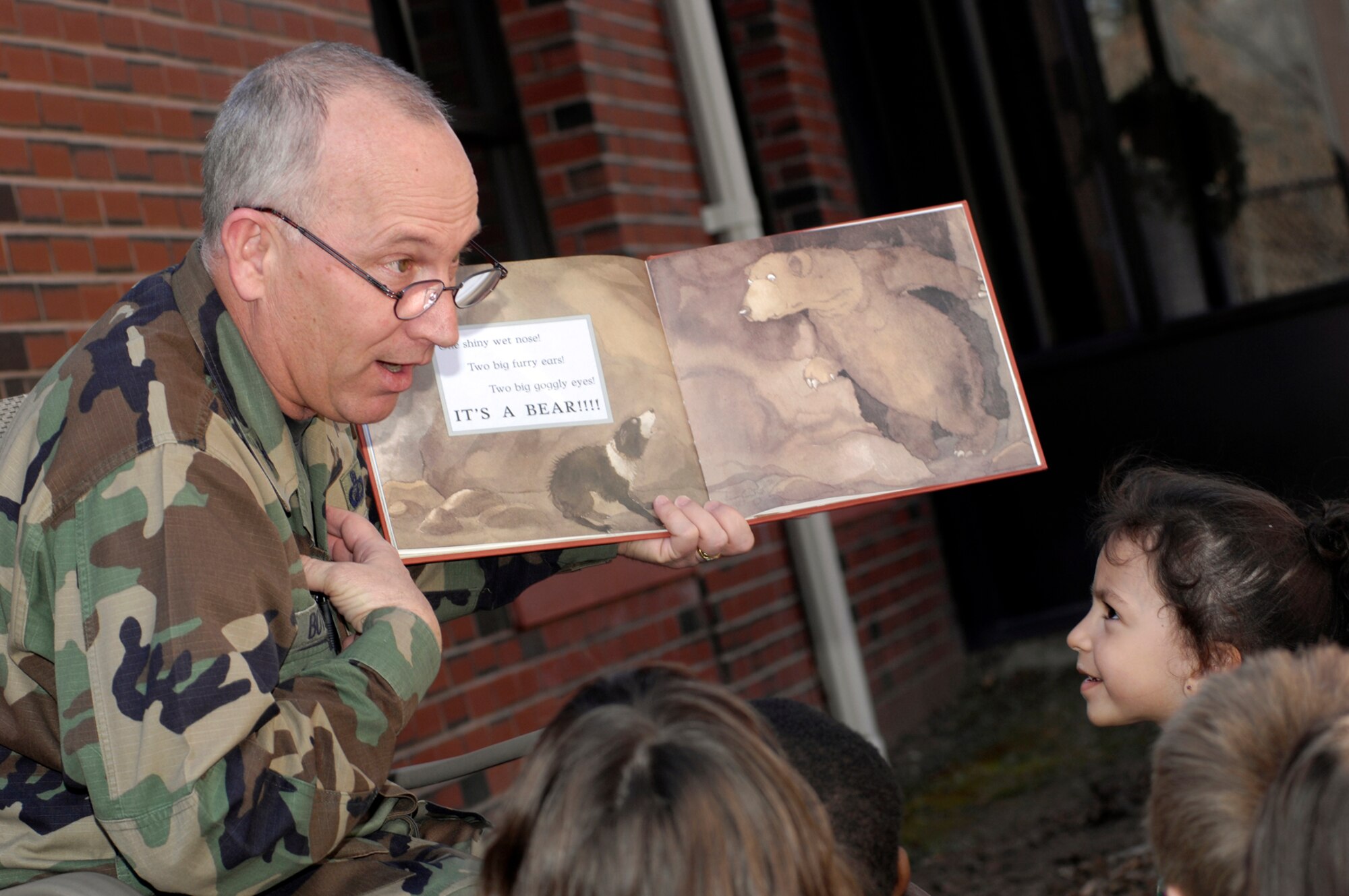 HANSCOM AFB, Mass. – Col. Robert Boyles, 66th Mission Support Group, commander reads to children at the Child Development Center during a Month of the Military Child Activity that took place in May. Colonel Boyles will retire on Sept. 29 after 26 years of Air Force service. (U.S. Air Force photo by Mark Wyatt)