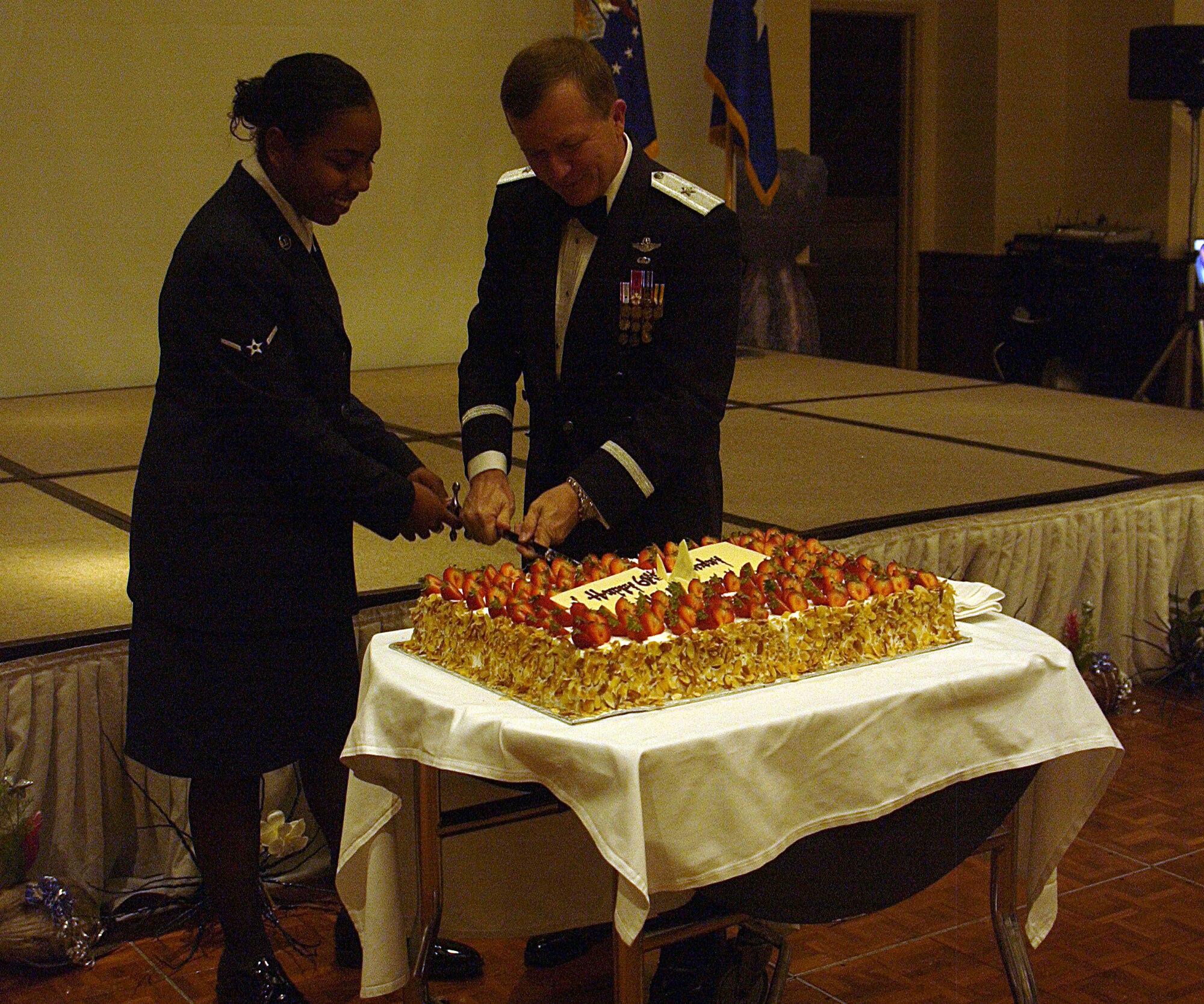 ANDERSEN AIR FORCE BASE, Guam - Brigadier Gen. Phil Ruhlman, 36th Wing commander, and the lowest ranking member attending the 61st Air Force Ball at the Hyatt Regency Guam cut the Air Force birthday cake Sept. 20. The theme for the ball was "Heritage of Change." (U.S. Air Force photo by Airman 1st Class Carissa Wolff)              