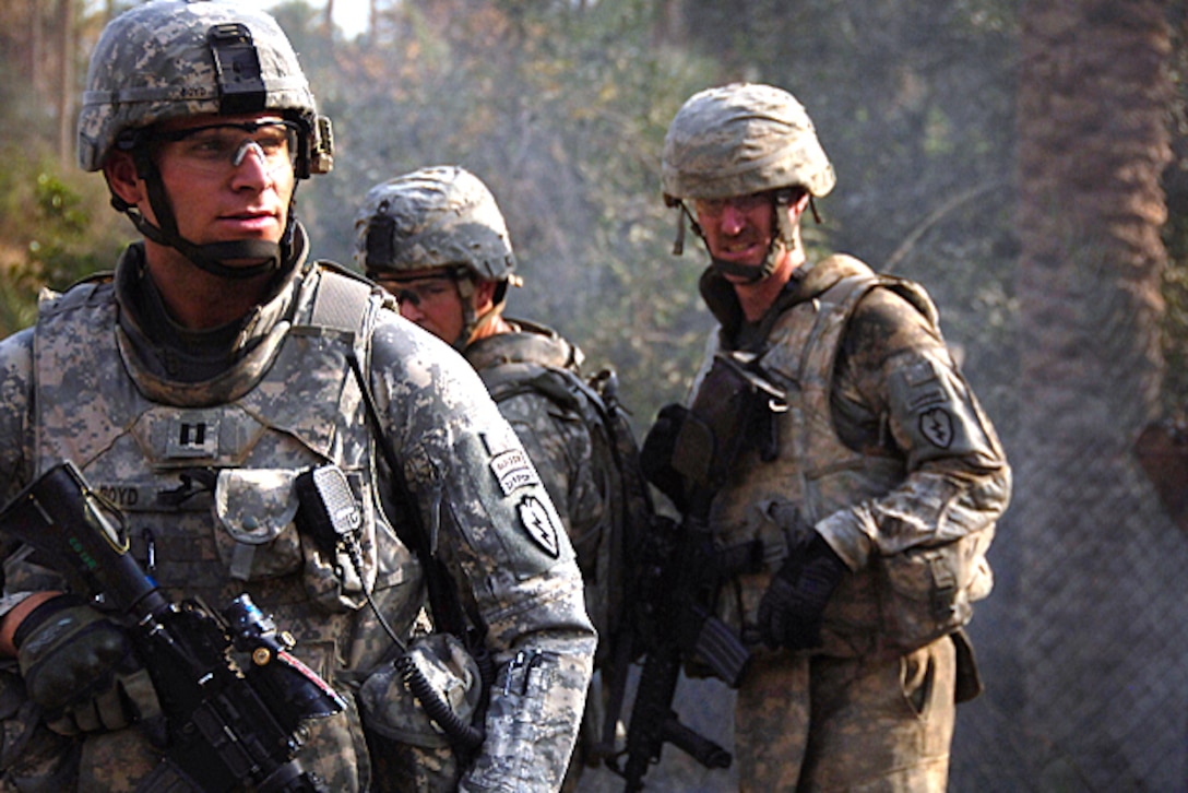 U.S. Army Capt. William Boyd oversees his soldiers as they conduct a ...