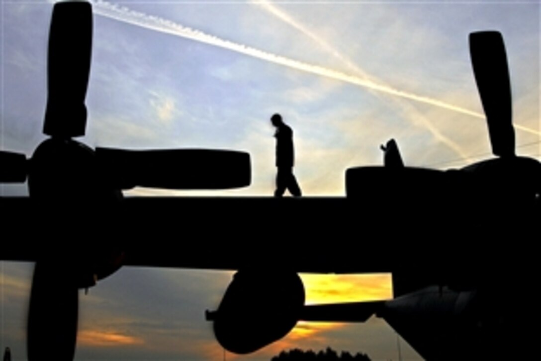 U.S. Air Force Airman 1st Class Phillip Bean performs a preflight inspection on a C-130 Hercules aircraft at Ramstein Air Base, Germany, Sept. 18, 2008. Bean is assigned to the 86th Aircraft Maintenance Squadron as a crew chief. 