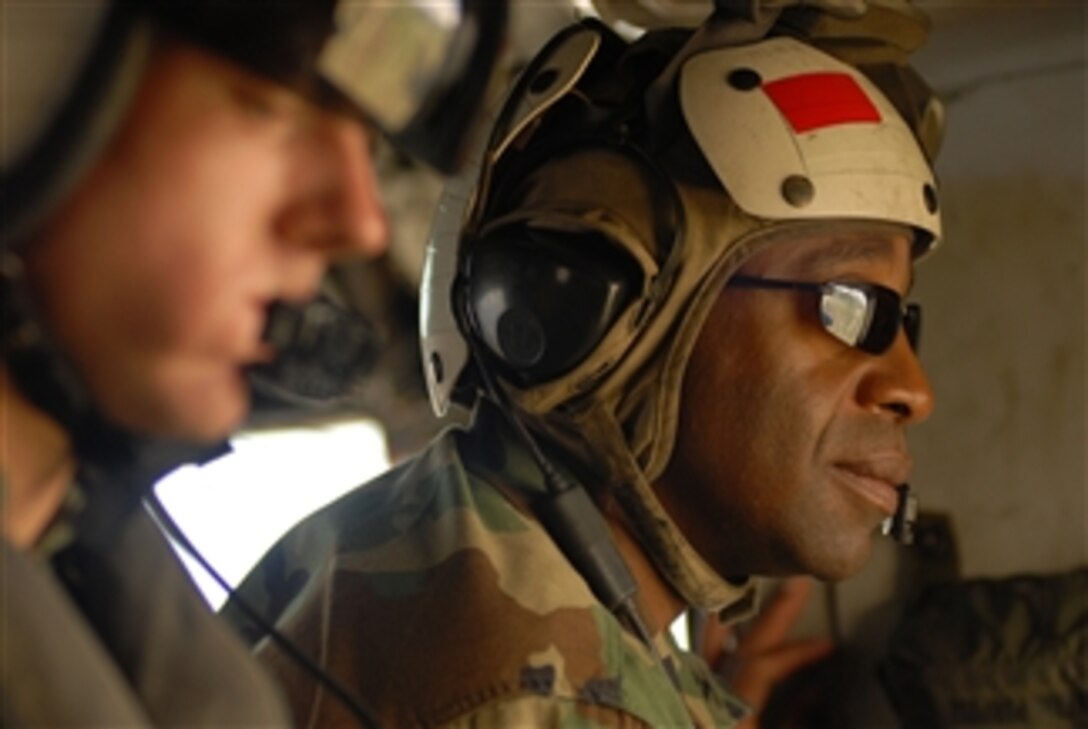 U.S. Navy Capt. Fernandez Ponds, commander of U.S. military relief operations in Haiti, looks out a window of a CH-53E Sea Stallion helicopter during a flight to remote areas in Haiti on Sept. 18, 2008.  The amphibious assault ship USS Kearsarge (LHD 3), which was diverted from its deployment in support of the humanitarian assistance mission Continuing Promise 2008, is currently refueling at Naval Station Guantanamo Bay, Cuba, before returning to Haiti to continue hurricane relief operations.  