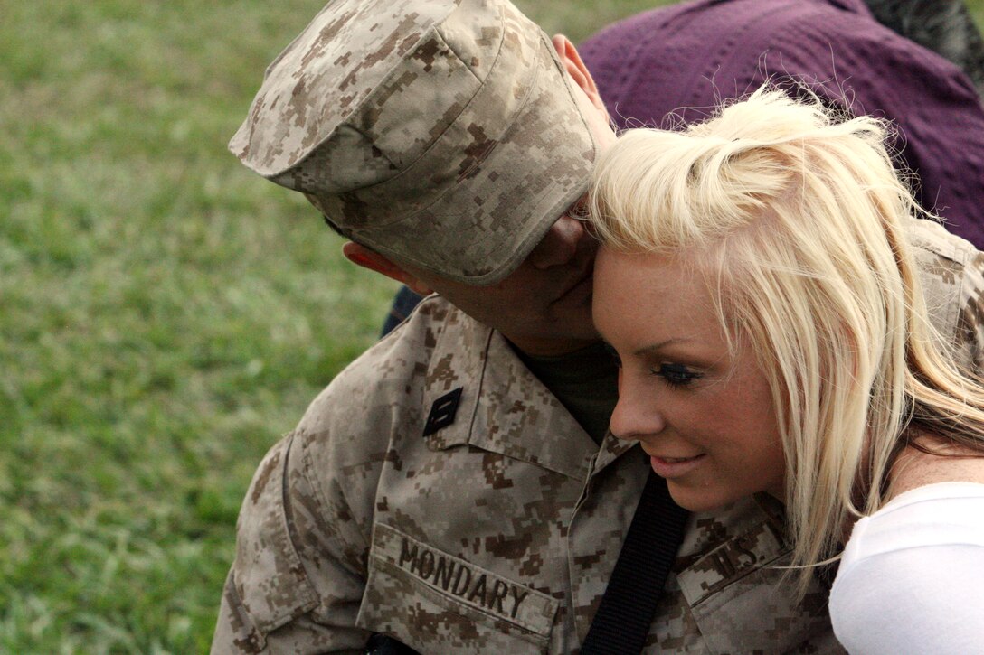 Seaman Steve Mondary, a hospital corpsman with Fox Company, 2nd Battalion, 9th Marine Regiment spends time with his girlfriend Sept. 23 before leaving to deploy in support of Operation Iraqi Freedom. Marines from 2nd Battalion, 9th Marines are deploying to Al Anbar province to support Iraqi forces in security operations. According to Mondary, corpsman are the medical backbone of the whole operation.