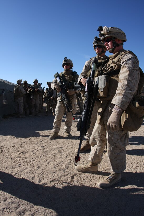 Marines from Company L’s 2nd Platoon, 3rd Battalion, 8th Marine Regiment, prepare to step out on a patrol of Sara Kowt, a mock Afghan town aboard the Combat Center’s training area, during a three-day-long final exercise Sept. 23 for a new Afghanistan-specific pre-deployment training evolution, known as Mojave Viper.