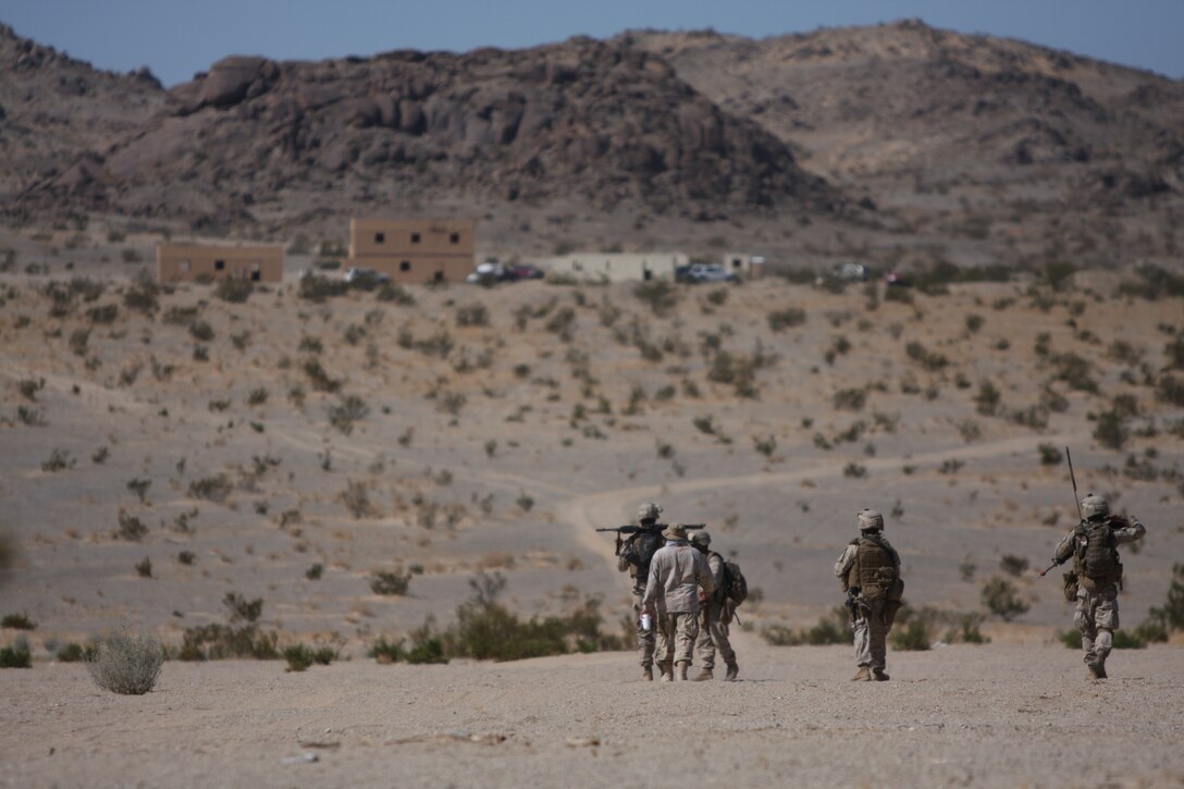 Marines with 2nd Platoon, Company L, 3rd Battalion, 8th Marine Regiment, and their interpreter head to a small mock village named Kala to perform a census after leaving Sara Kowt, a mock Afghan town aboard the Combat Center’s training area, during a three-day-long final exercise Sept. 23 for a new Afghanistan-specific pre-deployment training evolution, known as Mojave Viper.
