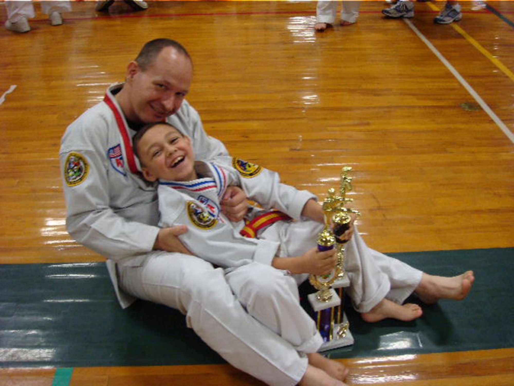 Army Sgt. 1st Class Tim Bell, an Army Reserve Career counselor, and his 8-year-old son, Austin, were both named state champions in American Tae Kwon Do Association competitions for the second year in a row. After competing in several competitions over the course of the year, Sergeant Bell came in first place in the traditional weapons, Xtreme forms and Xtreme weapons categories in the 40- to 49-year-old age bracket, while his son placed first in the same categories in the children's bracket. In 2007, both father and son were named state champions in the traditional weapons category. Both father and son live on Hanscom AFB. (Courtesy photo)