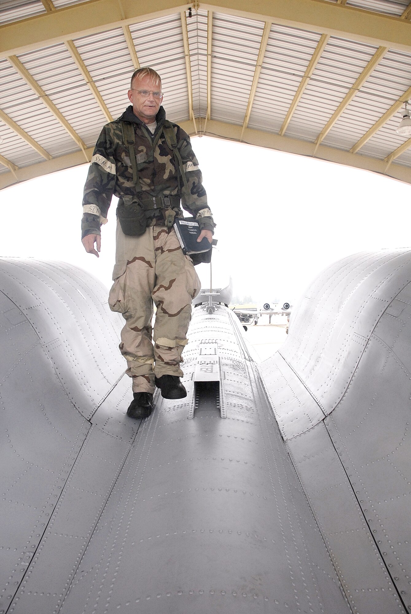 Dressed in mission-oriented-protection-posture gear, Master Sgt. Bradley Fidlar, 442nd Aircraft Maintenance Squadron crew chief, services an  A-10 Thunderbolt II  during September 2008's unit training assembly operational readiness exercise. The 442nd FW is an Air Force Reserve Command A-10 Thunderbolt II unit based at Whiteman Air Force Bace, Mo. (US Air Force photo/Tech. Sgt. Leo Brown). 