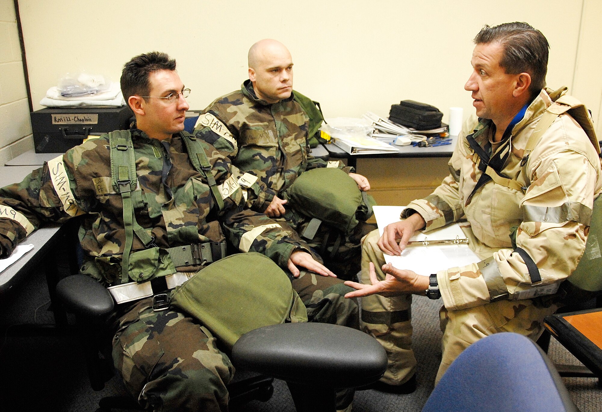 442nd Fighter Wing Chaplain (Maj.) James Buckman (right) delivers last minute instruction to his staff, Chaplain (Capt.) Benjamin Hayden (left) and Tech. Sgt.  Allen Haas (center) before they head out into the "play area" during September 2008's unit training assembly operational readiness exercise. The 442nd FW is an Air Force Reserve Command A-10 Thunderbolt II unit based at Whiteman Air Force Bace, Mo. (US Air Force photo/Staff Sgt. Kent Kagarise)