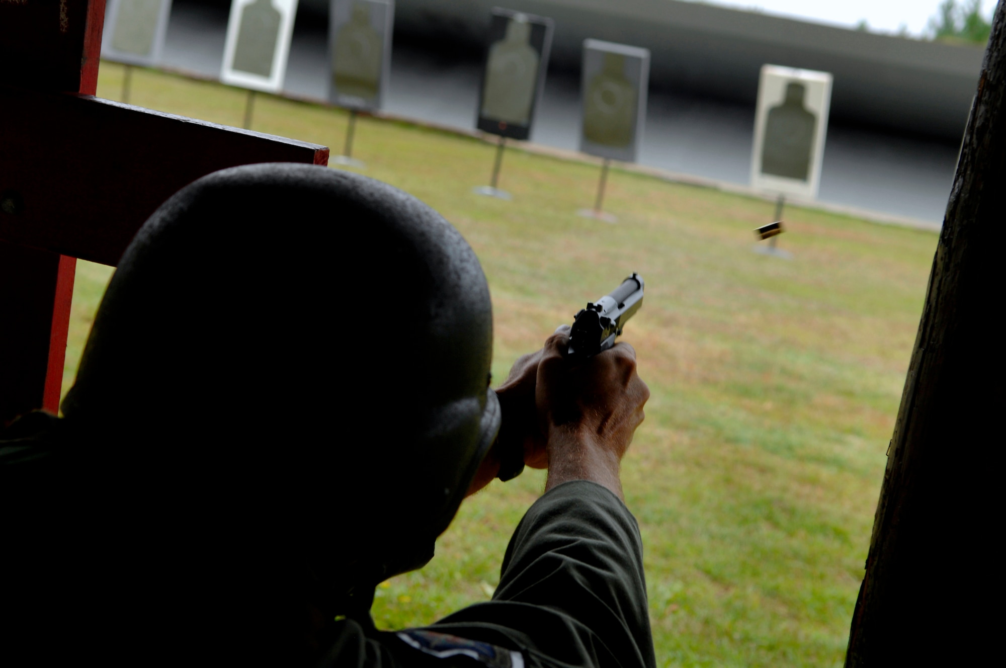 HURLBURT FIELD, Fla. -- Capt. Jan Stahl, a 33rd Operations Support Squadron pilot, fires a 9 mm handgun at a static target from the kneeling positions here, Sept. 18. To pass the course each student must hit the target at least 35 out of 50 times. (U.S. Air Force photo/ Senior Airman Julianne Showalter)