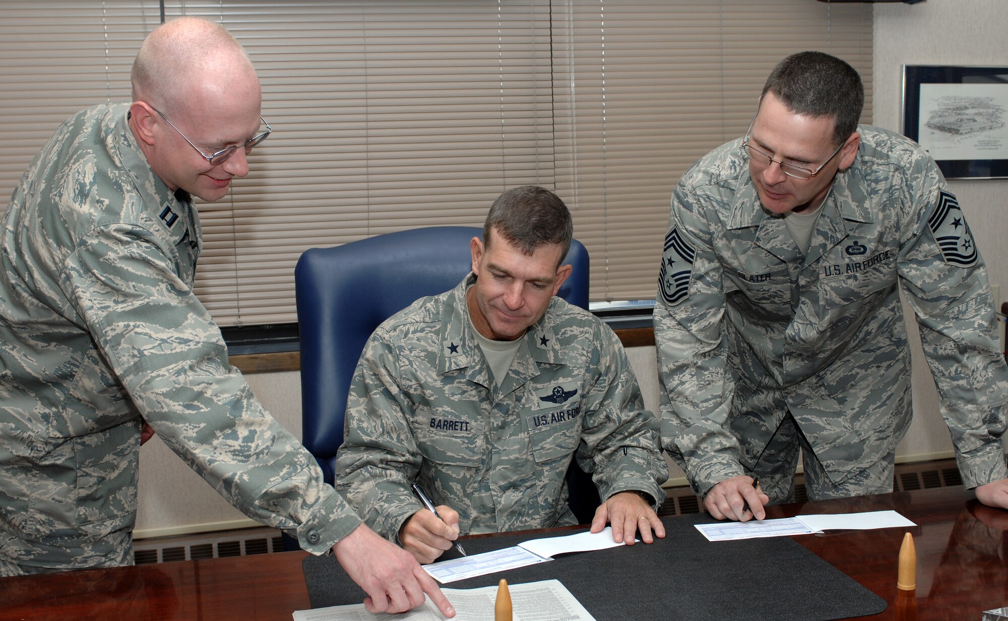 LANGLEY AIR FORCE BASE, Va. – Capt. Jason Kalman, the Combined Federal Campaign’s installation project officer shows Brig. Gen. Mark Barrett, 1st Fighter Wing commander and Chief Master Sgt. Kevin Slater 1st FW command chief, some of the information about CFC Sept. 23.  The program provides federal employees with an opportunity to support local national and international charities. The CFC runs from Oct. 1 to Nov. 7. (U.S. Air Force photo/Airman 1st Class Zachary Wolf)