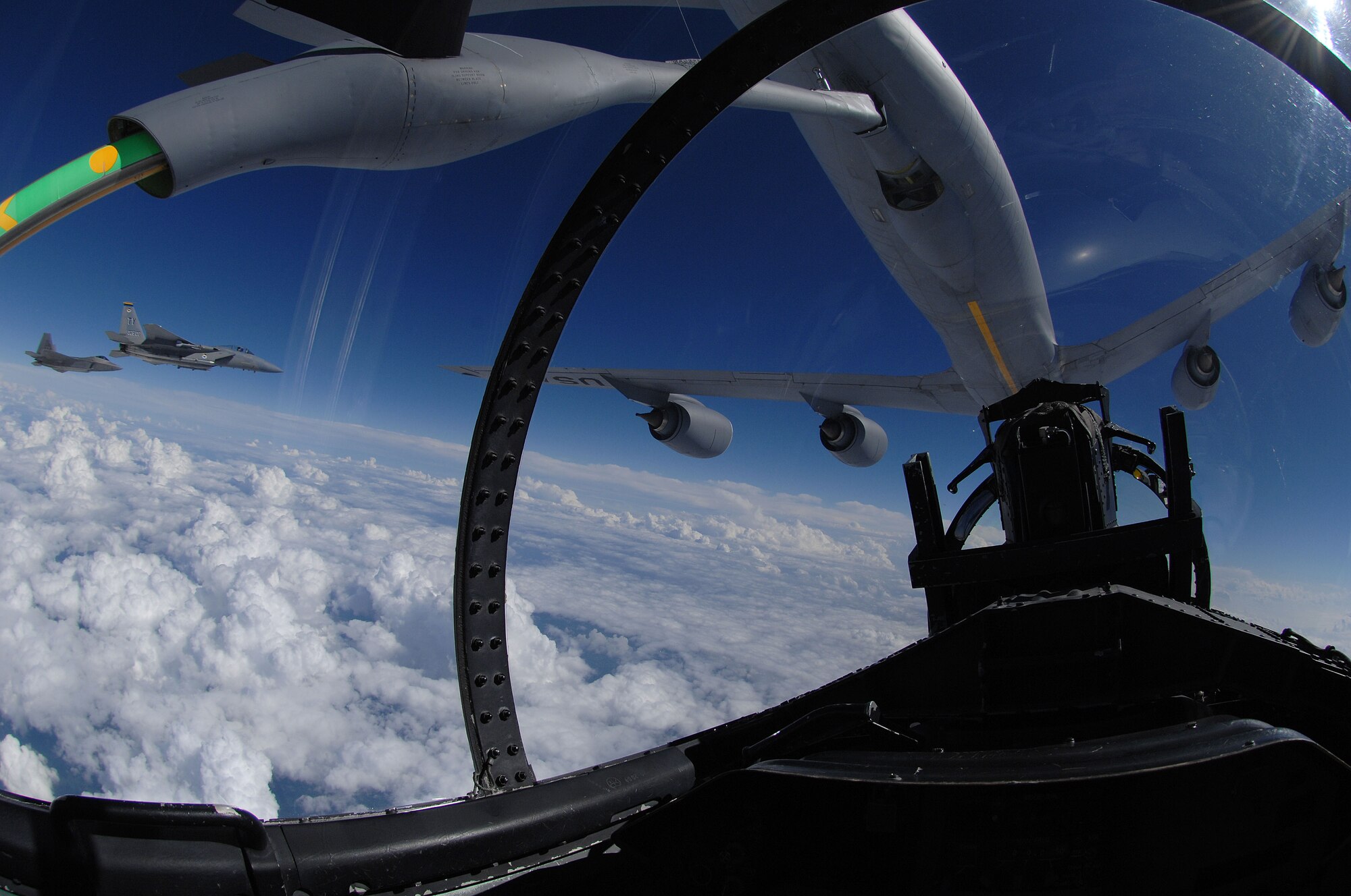 An F-22 Raptor and two F-15 Strike Eagles from Tyndall Air Force Base, Fla participate in a refueling mission with a KC-135 from the Mississippi Air National Guart over eastern Florida, September 22, 2008. (US Air Force photo by Master Sgt. Scott Reed)