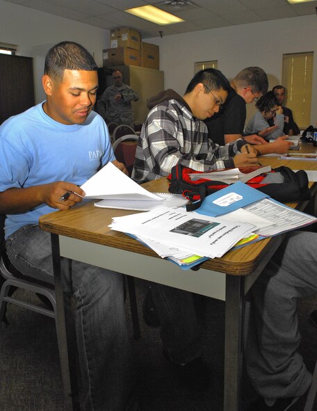 MINOT AIR FORCE BASE, N.D. –Warbirds and Rough Riders find time to advance their academics at the base education center here recently. The Airmen, all Park University students, work on completing an assignment for their Principles of Management class.  The assignment emphasized how important organizational work structure is in the business world. (U.S. Air Force photo by Airman 1st Class Benjamin Stratton)