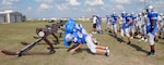 Linemen hit the blocking sled at a Randolph High football practice Monday, Sept. 22. The Ro-Hawks begin District 27-2A play this weekend against Blanco. (U.S. Air Force photo by Rich McFadden)