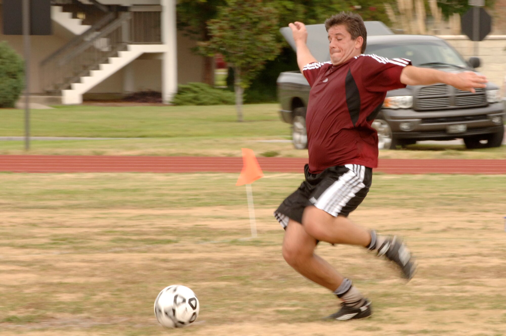 Ward Smith, USSOCM JMISC, attempts to kick the ball into the goal during an intramural soccer game at MacDill's Fitness Center,  Sept. 22.  The Fitness Center organized this intramural soccer game between the 6 Medical Group and SOCOM.  (U.S. Air Force Photo By SrA Nancy Hooks) (released)
