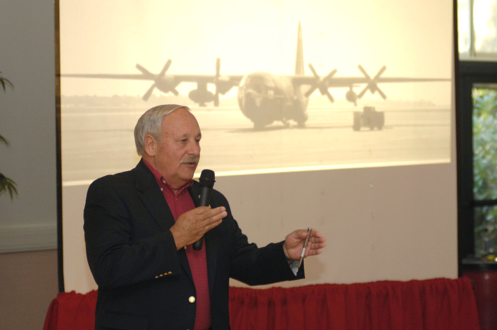 HANSCOM AFB, Mass. – Retired Maj. William A. Guenon, Jr., who served as a C-130 pilot during the Vietnam War, talks about his participation in a daring raid on North Vietnam’s Son Tay prison, to a crowd of 200 people at the Minuteman Club Sept. 19. (U.S. Air Force photo by Walter Santos)