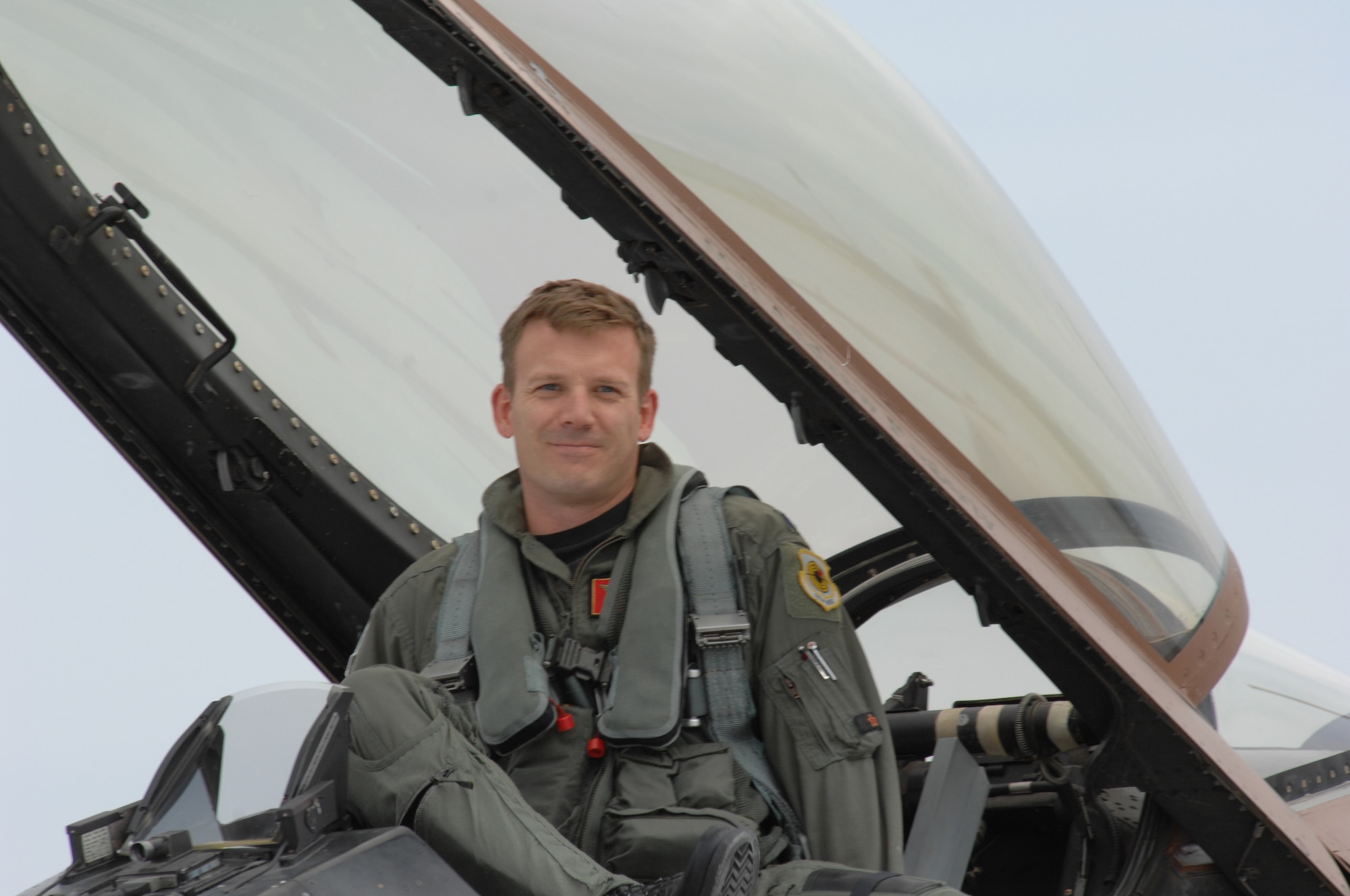 LANGLEY AIR FORCE BASE, Va. – Lt. Col. Brian Delamater, 64th Aggressor Squadron pilot, gets out of his F-16 fighter after a training exercise held here Sept. 17. The 64th AGRS from Nellis Air Force Base, Nev., was here to provide dissimilar aircraft training to Langley pilots. (U.S. Air Force photo/Tech. Sgt. April Wickes)