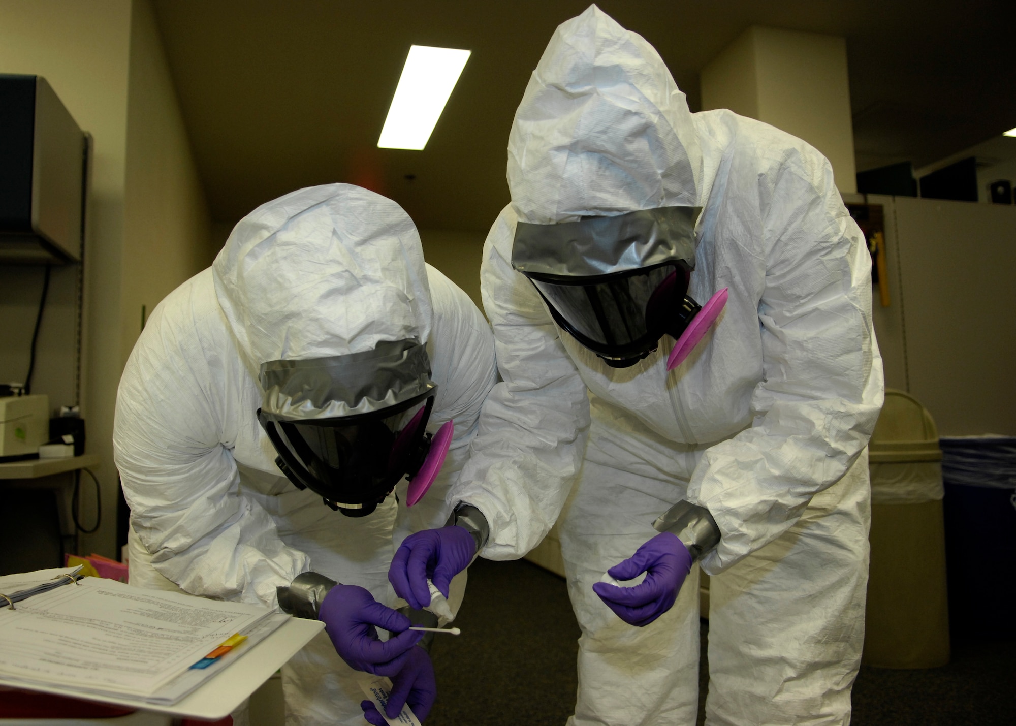 VANDENBERG AIR FORCE BASE, Calif. --  Airmen with the 30th Medical Operations Squadron's bioenvironmental engineering element test a sample of a suspicious powder during a training exercise here recently. The element conducts weekly training, but plays out a more in-depth scenario quarterly. (Courtesy photo)