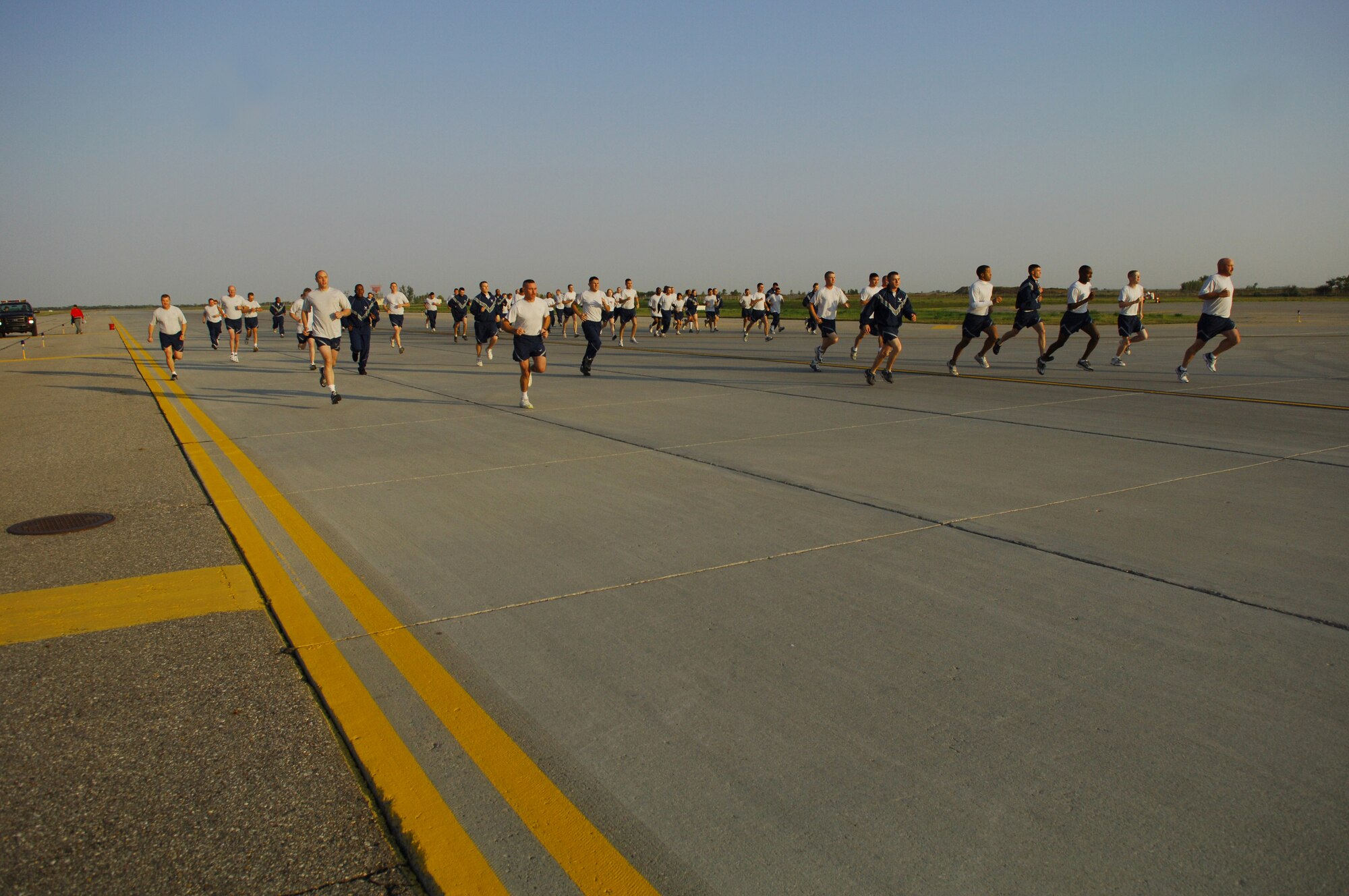 MINOT AIR FORCE BASE, N.D. – Airmen from the 5th Mission Support Group begin the 1.5 mile Taxiway Echo Fitness Run here Sept. 19. The fastest runner of the day was Airman 1st Class Matthew Beers, 5th Civil Engineer Squadron structural apprentice, with a run-time of 8 minutes, 5 seconds. (U.S. Air Force photo by Senior Airman Cassandra Jones)

