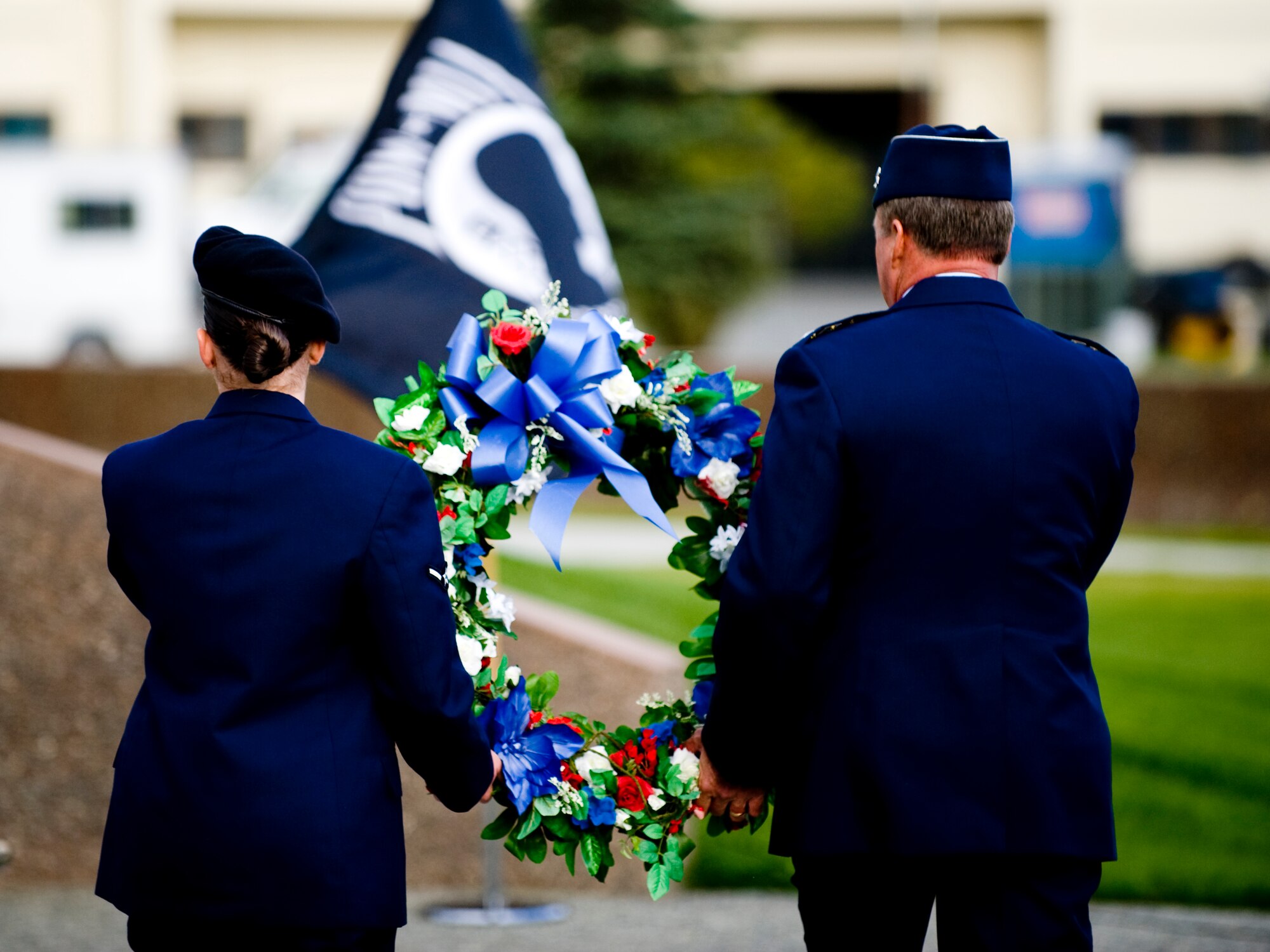 ELMENDORF AIR FORCE BASE, Alaska -- Lt. Gen. Dana Atkins (right) and Airman Desiree Williams prepare to place a wreath on the POW/MIA memorial during a ceremony Sept. 19 honoring all Prisoners of War and those still Missing in Action. A wreath was placed by members of each respective branch of service. General Atkins is the Commander, 11th Air Force, Alaskan Command and Alaskan NORAD Region. Airman Williams is assigned to the 3rd Security Forces Squadron here. (U.S. Air Force photo/Staff Sgt. Joshua Garcia)