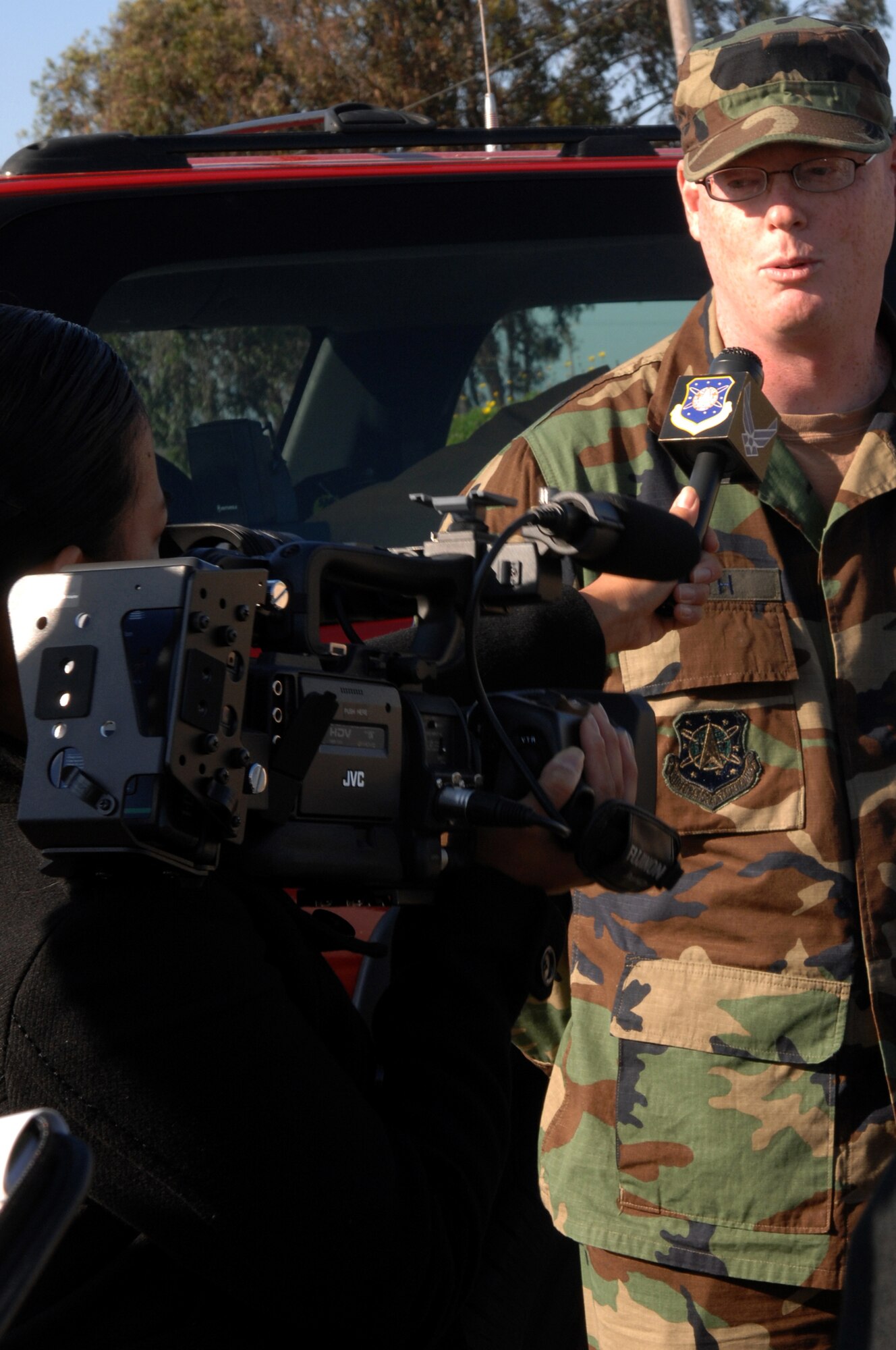 VANDENBERG AIR FORCE BASE, Calif.-- Tech. Sgt. Erin Smith, the battalion chief of the Vandenberg Fire department, fields questions from a "reporter" about an exercise C-17 crash on Sept. 17.  Sergeant  Smith explains the emergency response measures taken shortley after declaring an inflight emergency.  (U.S. Air Force photo / Senior Airman Nicole Roberts) 
