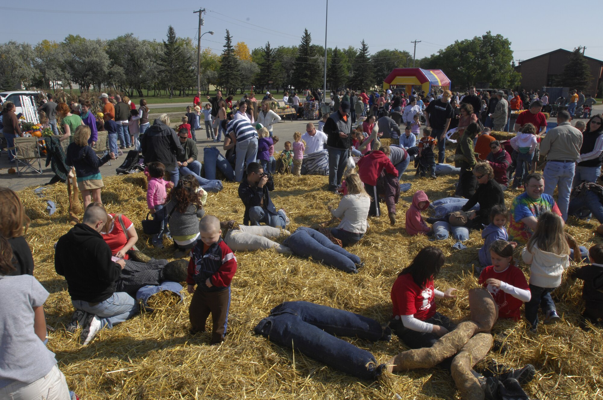 MINOT AIR FORCE BASE, N.D. — Team Minot families enjoy the Fall Festival, held at the base shoppette parking lot here Sept. 20.  The 741st Missile Squadron sponsored the 10th annual event which featured the scarecrow-making area and many other fun activities. (U.S. Air Force photo by Airman 1st Class Jesse Lopez)