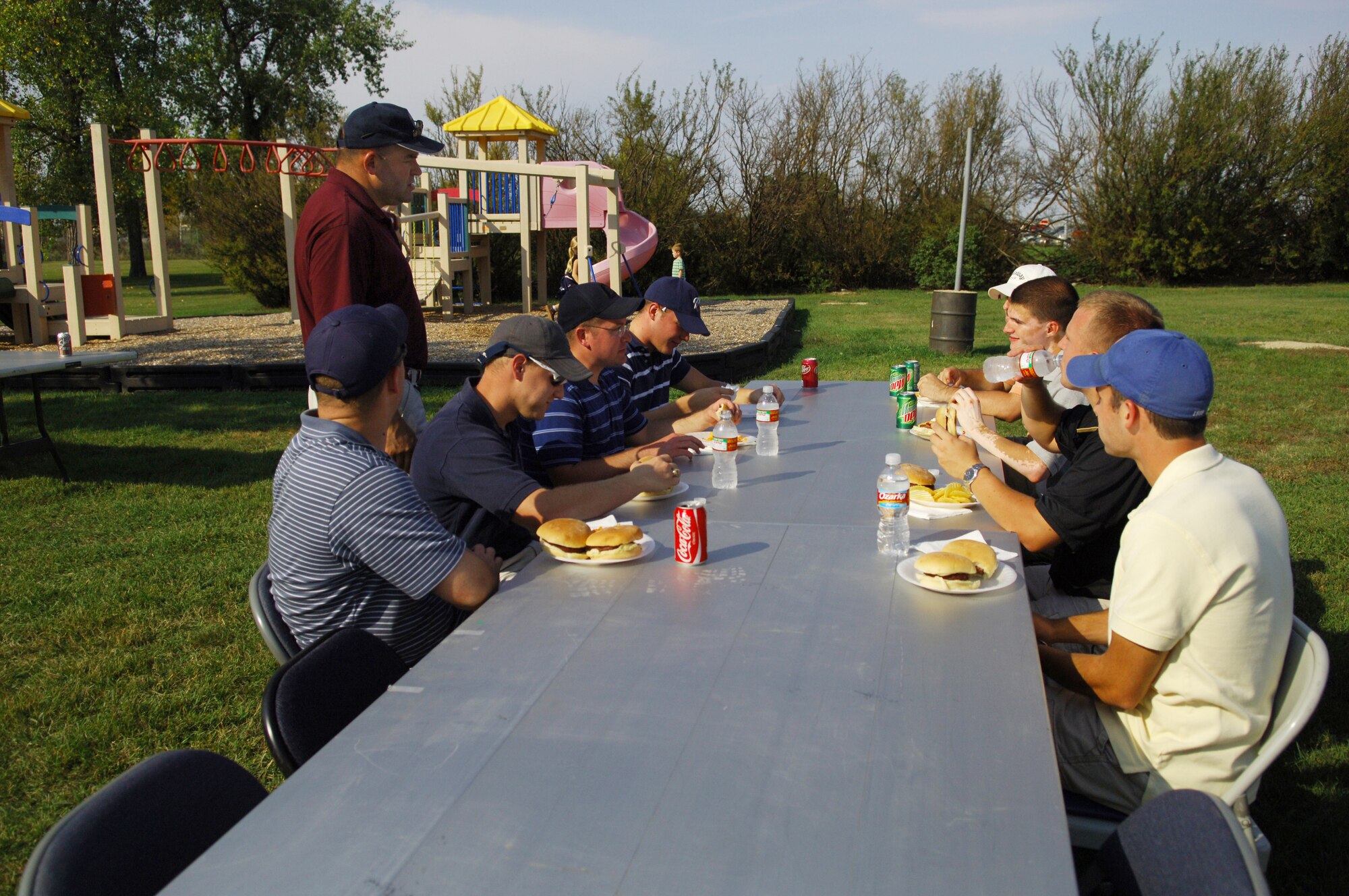 MINOT AIR FORCE BASE, N.D. – Col. Chris Ayres (standing), 91st Missile Wing commander, talks to Airmen from the 741st Missile Squadron during the 91st MW picnic at the golf course here Sept. 19. The picnic and golf tournament were designed to enhance esprit de corps and show thanks for the hard work the Airmen of the 91st MW have done in preparation for upcoming inspections. (U.S. Air Force photo by Senior Airman Cassandra Jones)