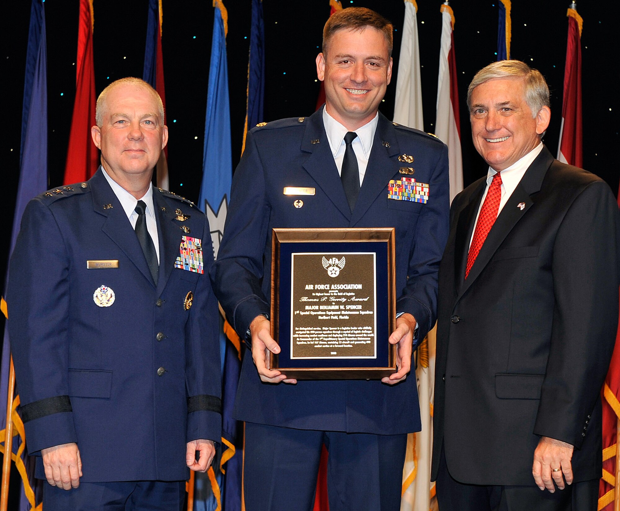 Maj. Benjamin Spencer (center) receives the Thomas P. Gerrity Award at the Air Force Association's 2008 Air and Space Conference and Technology Exposition from Lt. Gen. Donald C. Wurster (left) and Robert Largent (right) Sept. 10 in Washington, D.C. The Gerrity Award recognizes the individual who made the most outstanding contribution in the field of systems and logistics. Major Spencer is the 1st Special Operations Equipment Maintenance Squadron commander. General Wurster is the Air Force Special Operations Command commander, and Mr. Largent is the Air Force Association chairman (U.S. Air Force photo/Michael Pausic)
