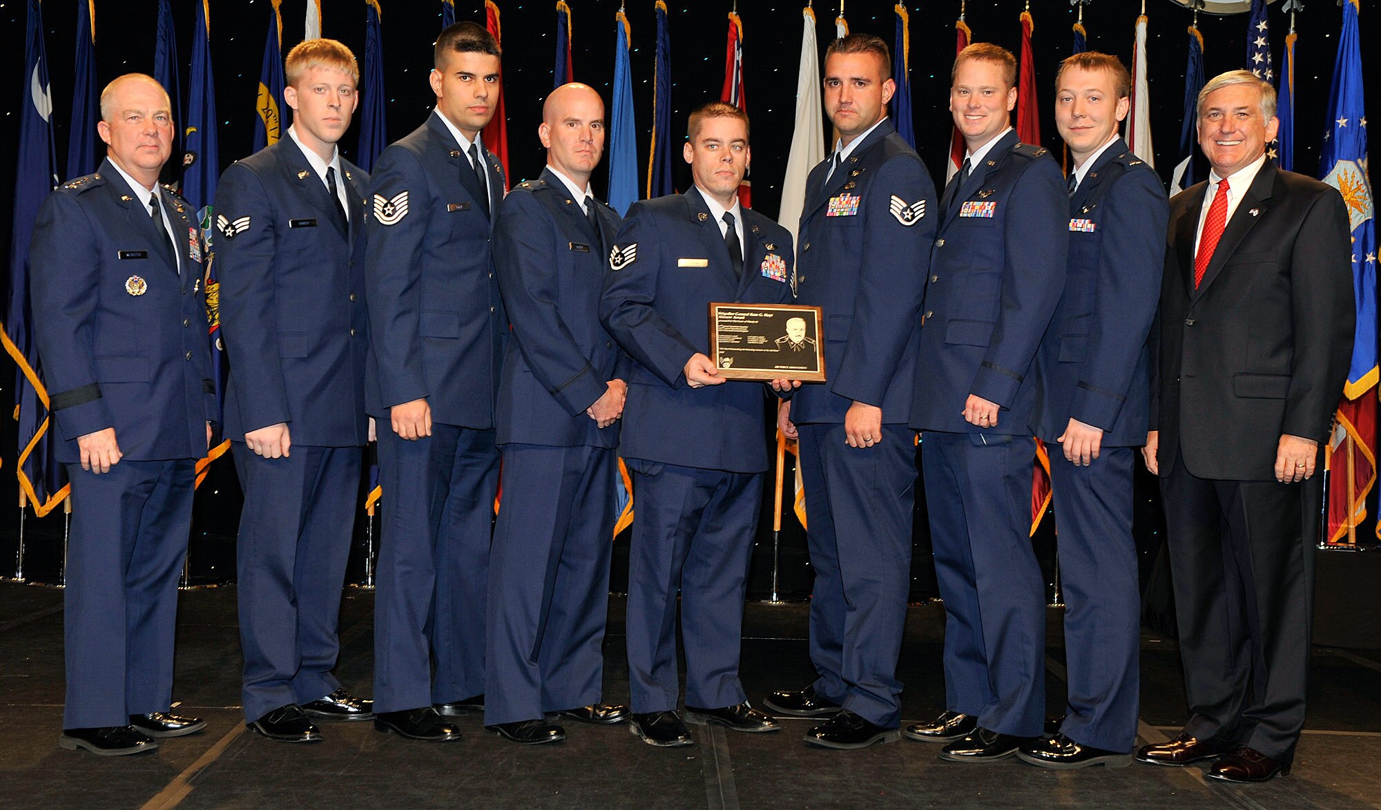 The crew of Woody 26 receives the Brig. Gen. Ross G. Hoyt Award at the Air Force Association's 2008 Air and Space Conference and Technology Exposition from Lt. Gen. Donald C. Wurster (far left) and Robert Largent (far right) Sept. 10 in Washington, D.C. The Hoyt Award is awarded the best air refueling crew in the Air Force. Crew members are with the 67th Special Operations Squadron from Royal Air Force Mildenhall, England. General Wurster is the Air Force Special Operations Command commander, and Mr. Largent is the Air Force Association chairman (U.S. Air Force photo/Michael Pausic) 
