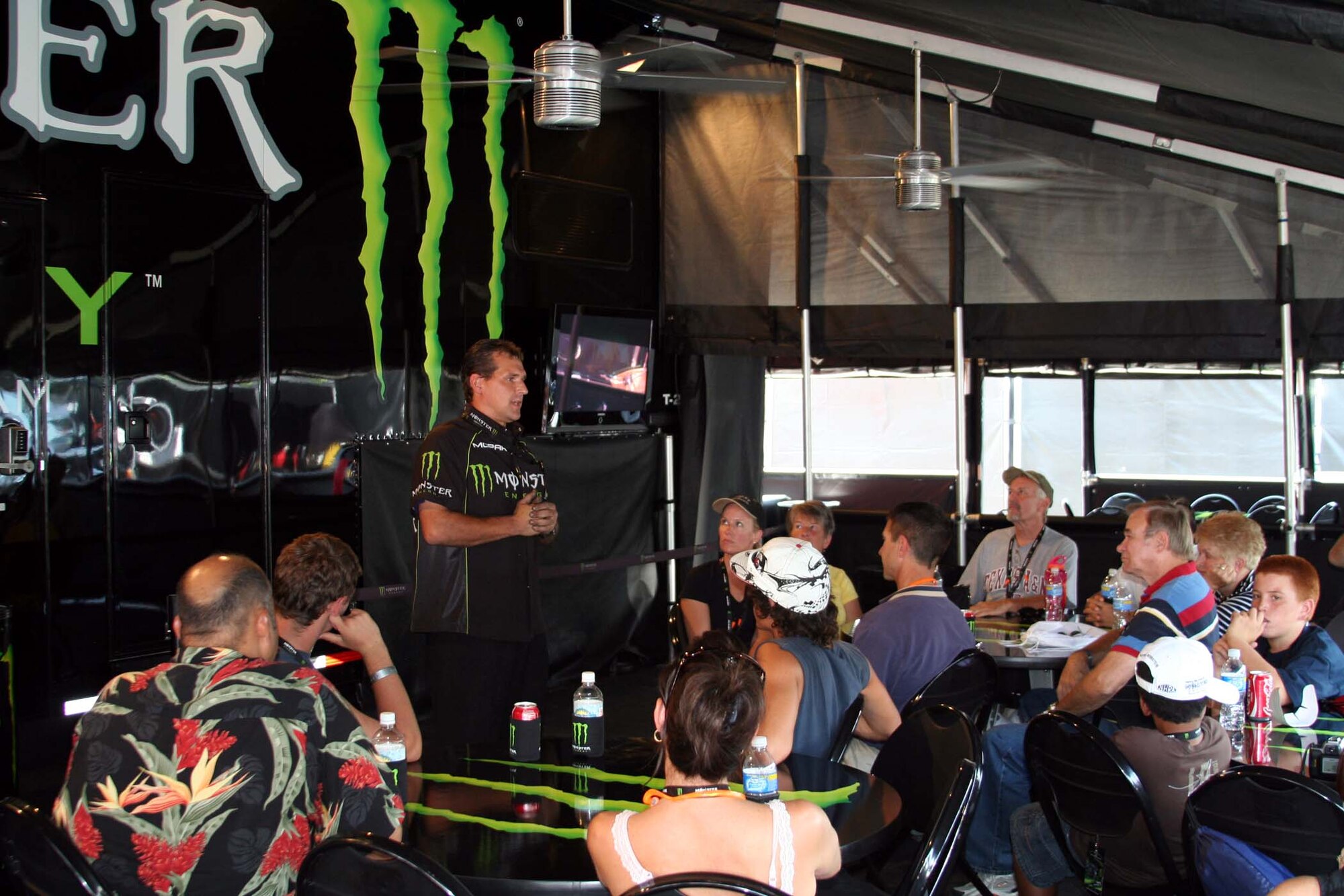 Doug Nosewicz, a mechanic for the Monster/U.S. Air Force funny car team, talks to Air Force influencers and prospects Sept. 22, about the similarities between working on high-performance cars and military aircraft. Mr. Nosewicz spent 20 years in the Navy as a crew chief. (Photo by Tech. Sgt. John Redding)