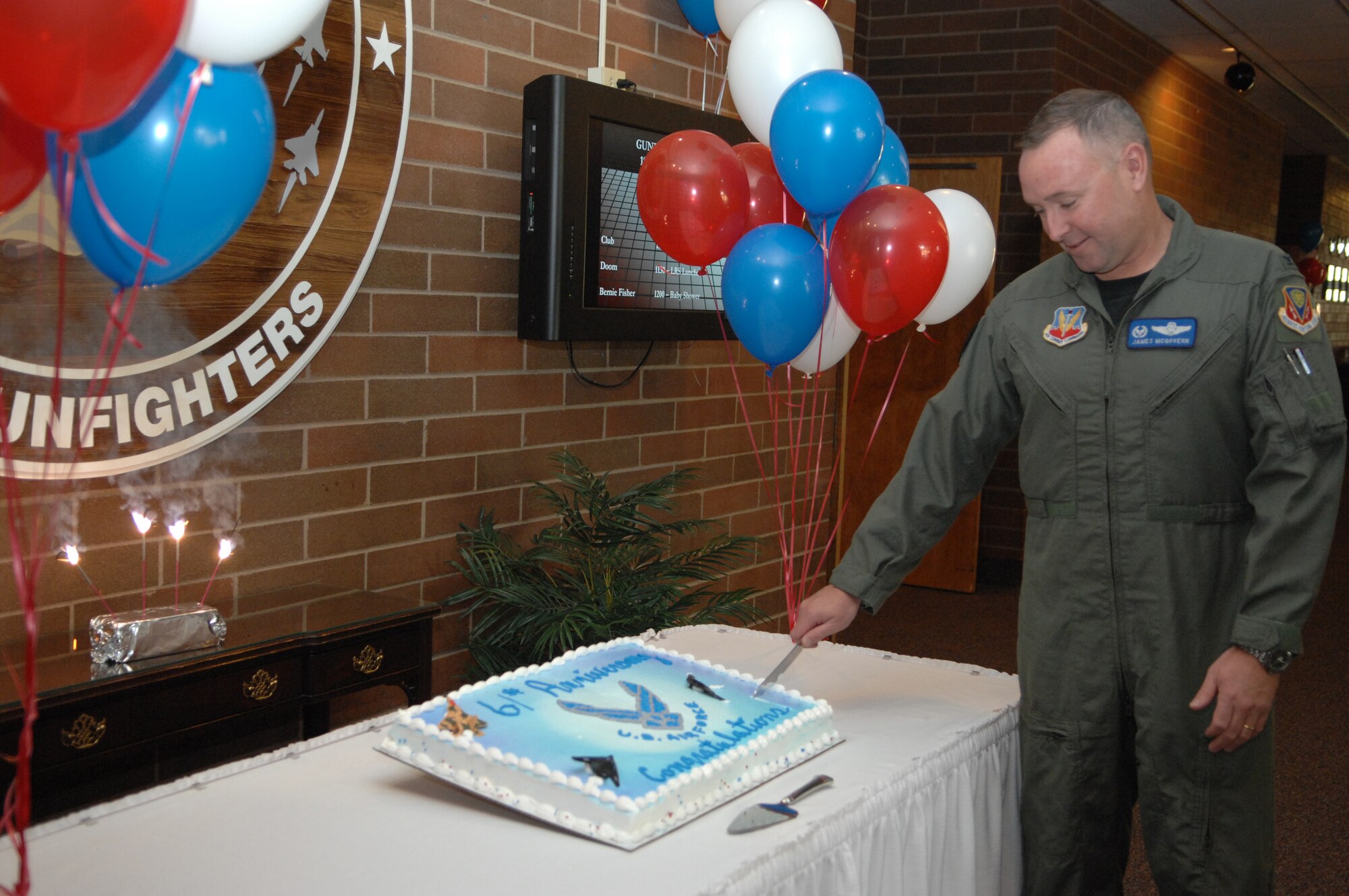 MOUNTAIN HOME AIR FORCE BASE, Idaho -- Col. James McGovern, 366th Operations Group commander, cuts the cake celebrating the Air Force’s 61st birthday at the Gunfighter Club Sept. 18. The Air Force was established on Sept. 18, 1947, when President Harry S. Truman signed the National Security Act was signed by. Currently, the Air Force has a total strength of more than 300,000 people and more than 5,000 aircraft. (U.S. Air Force photo/ Airman 1st Class Ashley Tank) 