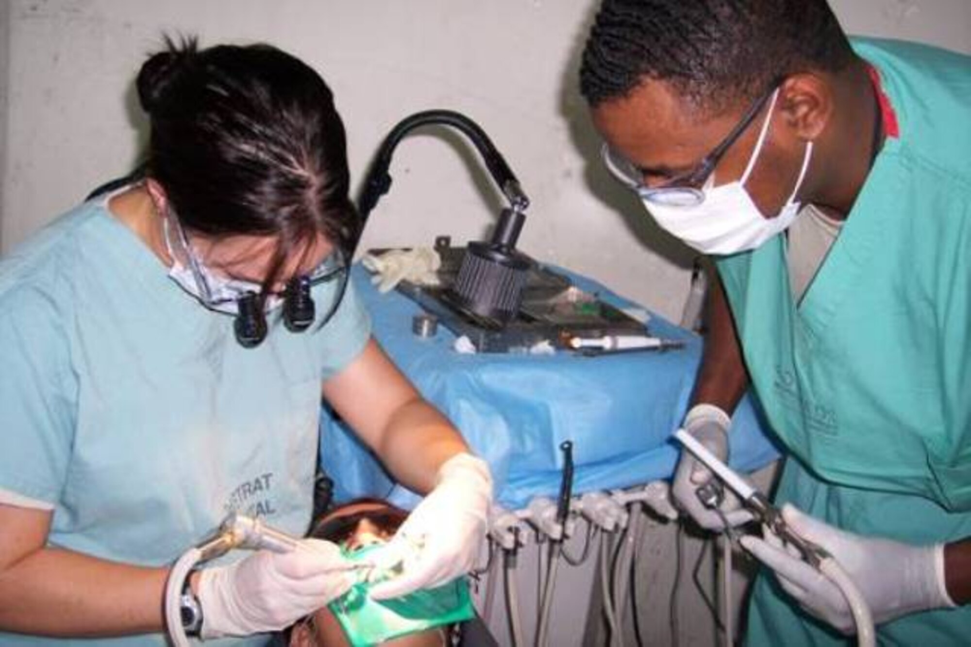 Capt. Heather Tellez, 1st Dental Squadron dentist, and Staff Sgt. Julian Moore, 2nd Dental Squadron dental assistant from Barksdale Air Force Base, La. take care of a patient while deployed to Zacatecoluca, El Salvador with first-ever All Dental Readiness Training Exercise team.  DENTRETE is the first humanitarian mission of its kind, and personnel deploy with modern equipment and supplies to provide a full spectrum of dental care.  For the duration of the mission the dental team provides care to include dental restorations (fillings), endodontics (root canals), extractions and dental prophylaxis (dental cleanings).  The staging area for the treatment was out of Destacamento Militario number nine in Zacatecoluca, El Salvador Sept. 8-18.   Surrounding communities were transported in for the free dental care over this 10-day period.  (photo provided by 1st Dental Squadron)