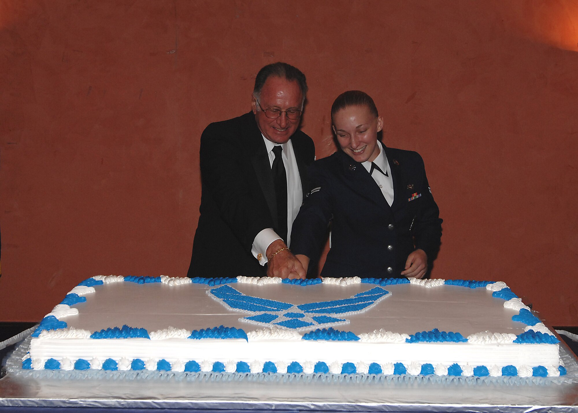 Retired Lt. Col. Mel Pollack helps Airman 1st Class Rebecca Hurlburt of the 31st Security Forces Squadron cut the Air Force birthday cake during the 61st Air Force Birthday Ball at La Bella Vista Club Sept. 19. It is Air Force Birthday Ball tradition for the oldest and youngest military member to perform the first cut of the cake. Colonel Pollack, a former Vietnam prisoner of war, was the guest speaker at this year's event. (U.S. Air Force photo/Tech. Sgt Patrick R. Hyde)