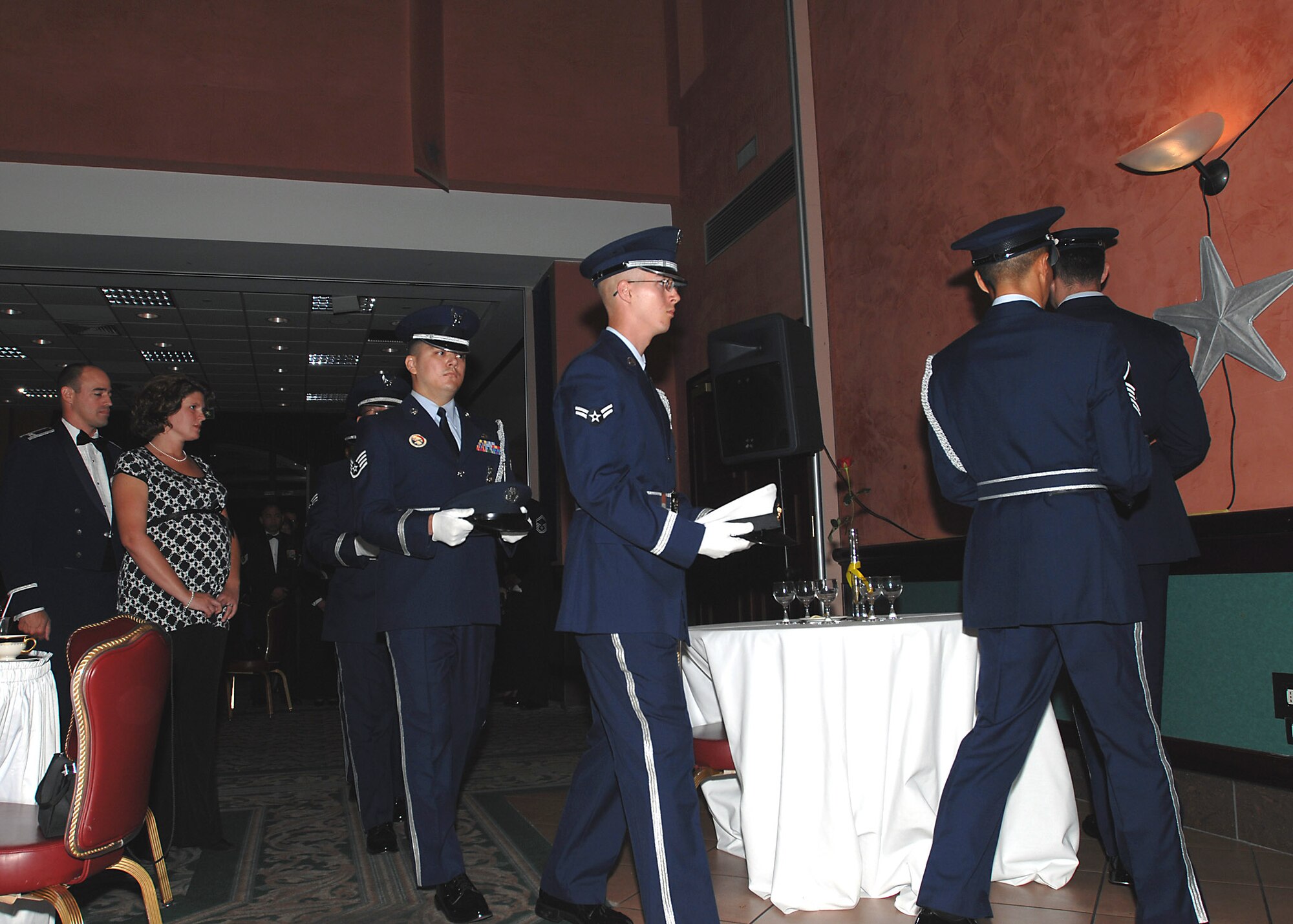 The 31st Fighter Wing Base Honor Guard performs the "Missing Man Table" tribute to honor prisoners of war and those missing in action during the 61st Air Force Birthday Ball at the La Bella Vista Club Sept. 19.  (U.S. Air Force photo/Tech. Sgt Patrick R. Hyde)