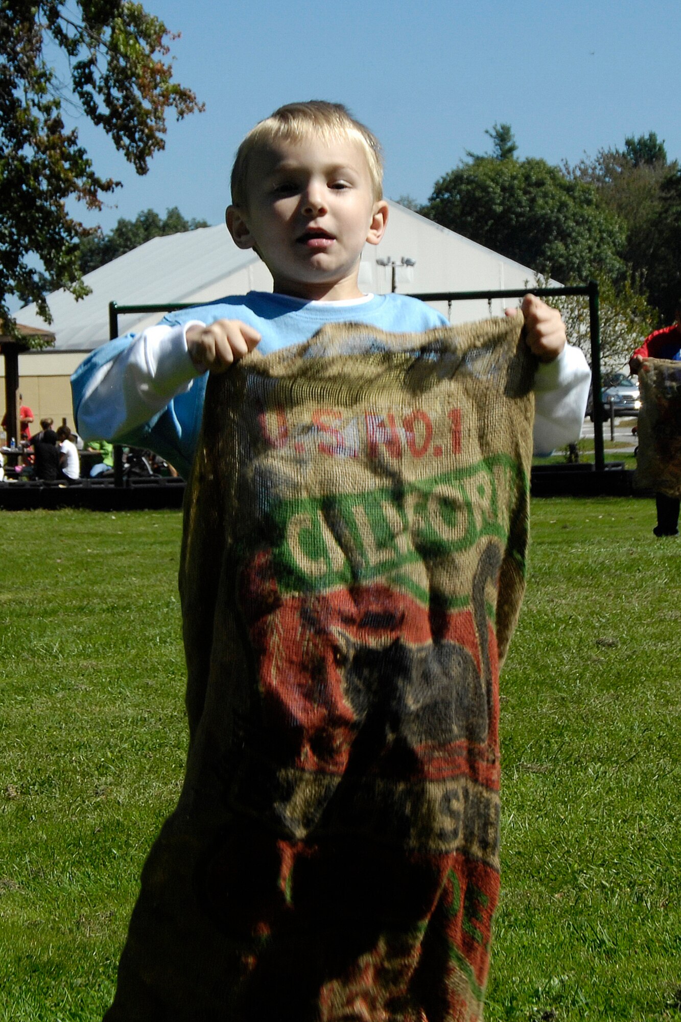 HANSCOM AFB, Mass. –Spencer Caskey hops towards the finish line in the sack race at the annual Boys and Girls Clubs of America Day for Kids. More than 300 children participated in the event at Castle Park on Sept. 20.  (U.S. Air Force photo by Linda LaBonte Britt)