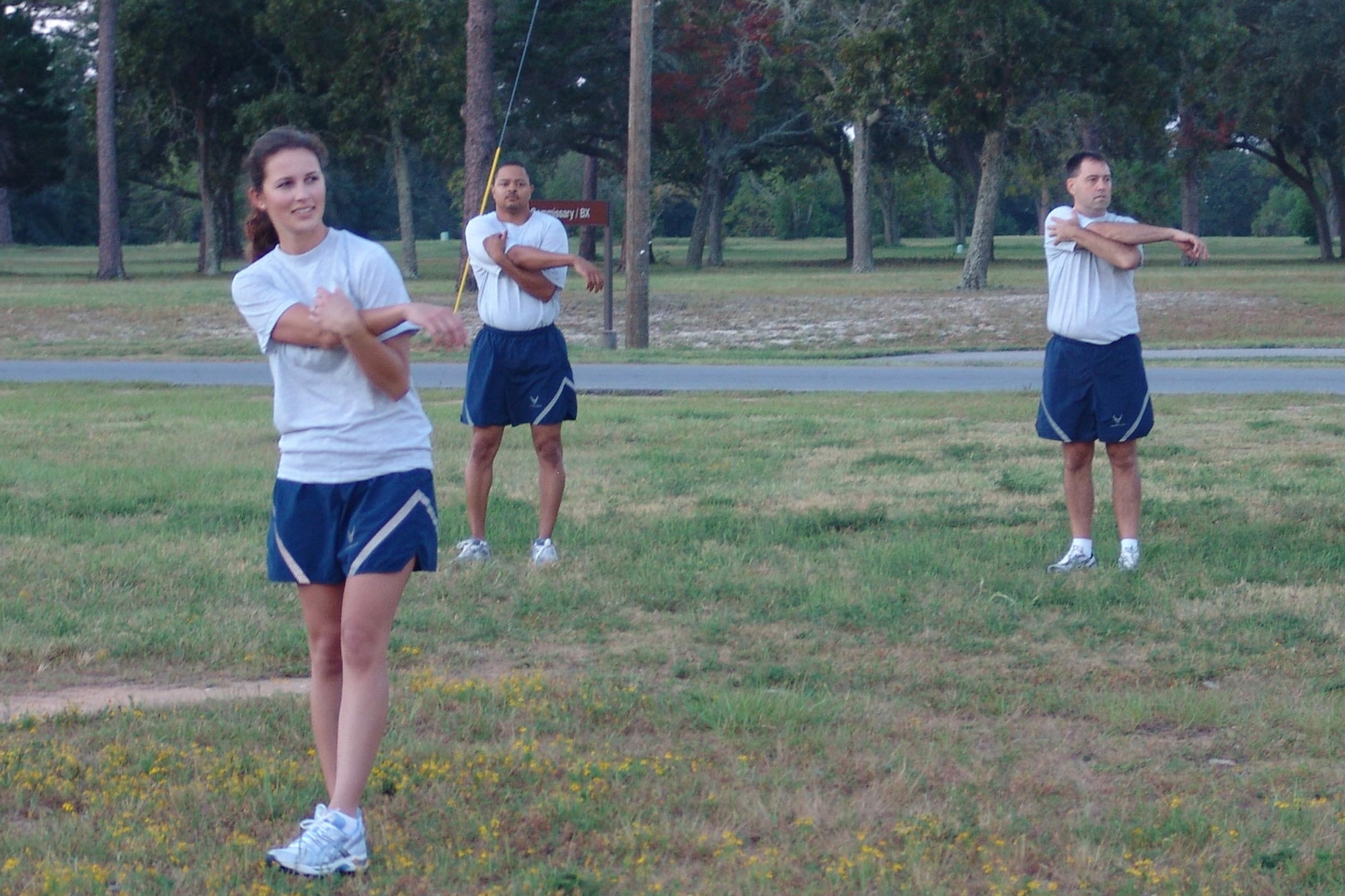 Second Lt. Christine Meyling, 96th Air Base Wing executive officer, leads physical fitness warmups for the wing staff agencies. (USAF photo by Lois Walsh)                            