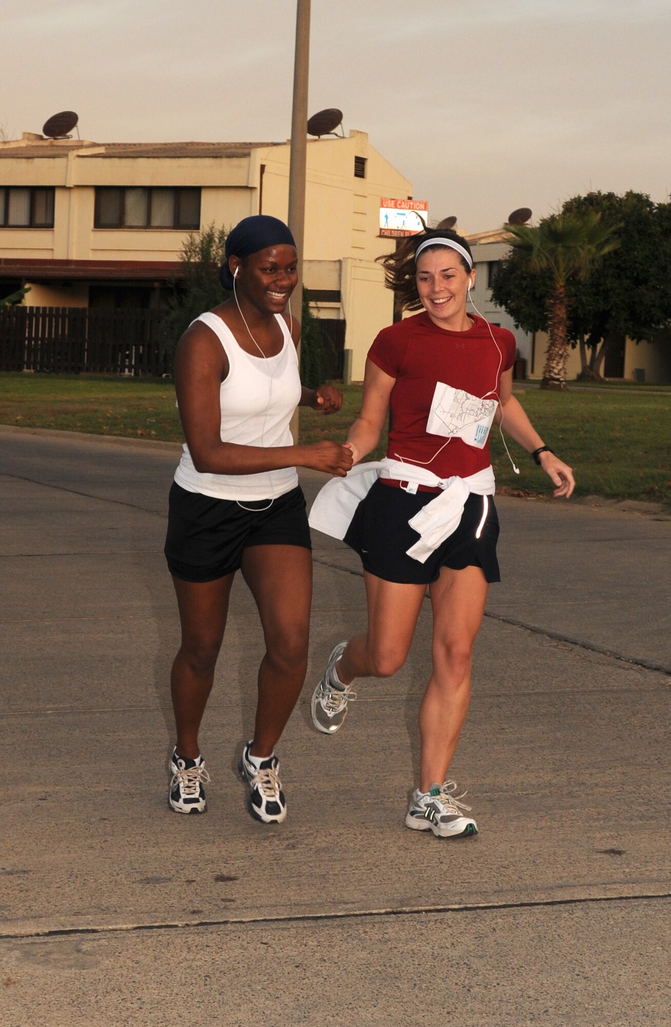 Relay team members change off during the Incirlik 1/2 Marathon Sept. 20. The event not only included a 13.1-mile run, but also a four-person relay and a 5K walk. (U.S. Air Force photo by Senior Airman Heather Stanton)