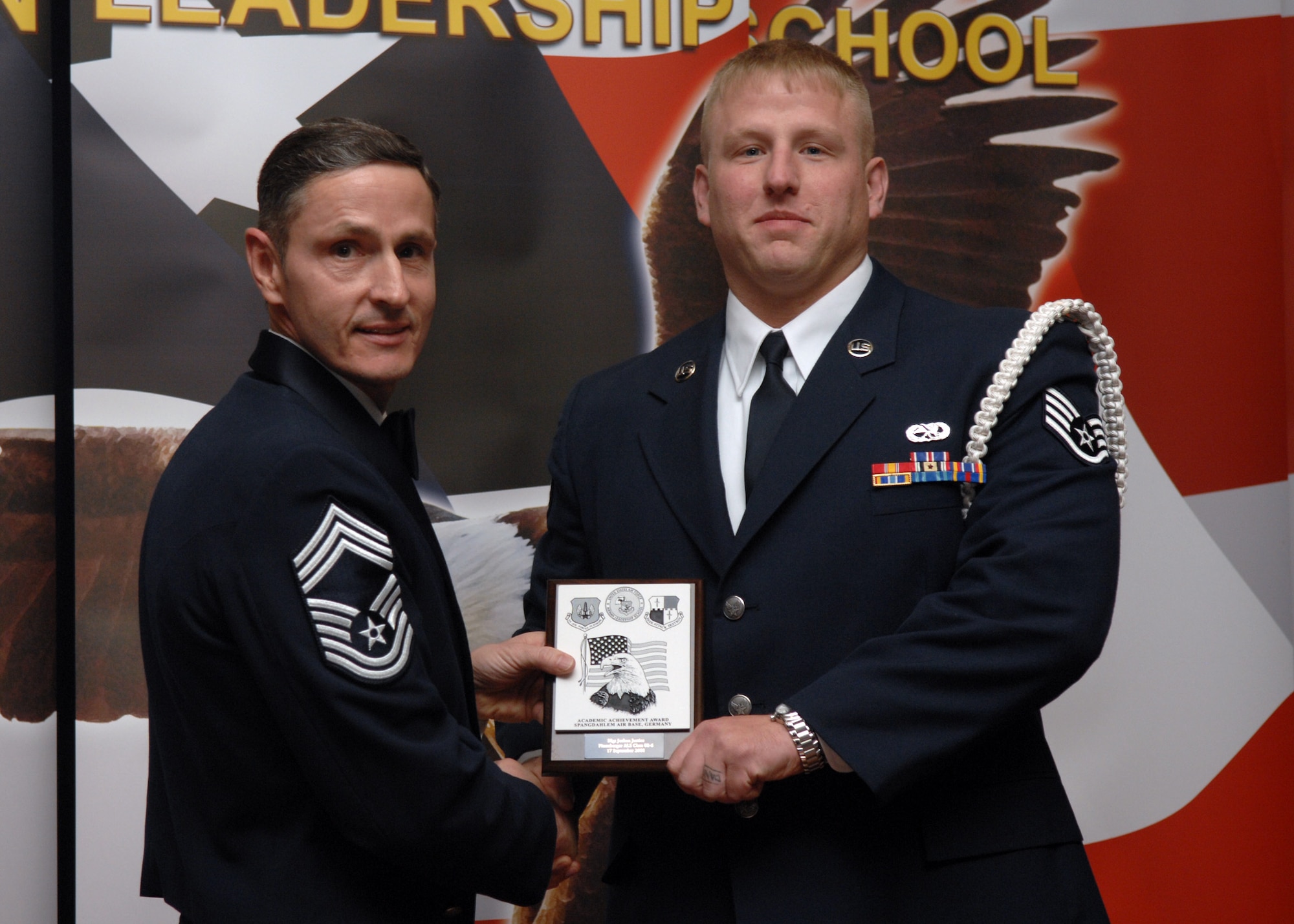 SPANGDAHLEM AIR BASE, Germany –- Staff Sgt. Joshua Justice, 52nd Equipment Maintenance Squadron, receives the Academic Achievement Award at the Airman Leadership School Graduation, class 08-6, Sept. 17, 2008. (U.S. Air Force photo by Airman Staci Miller)

