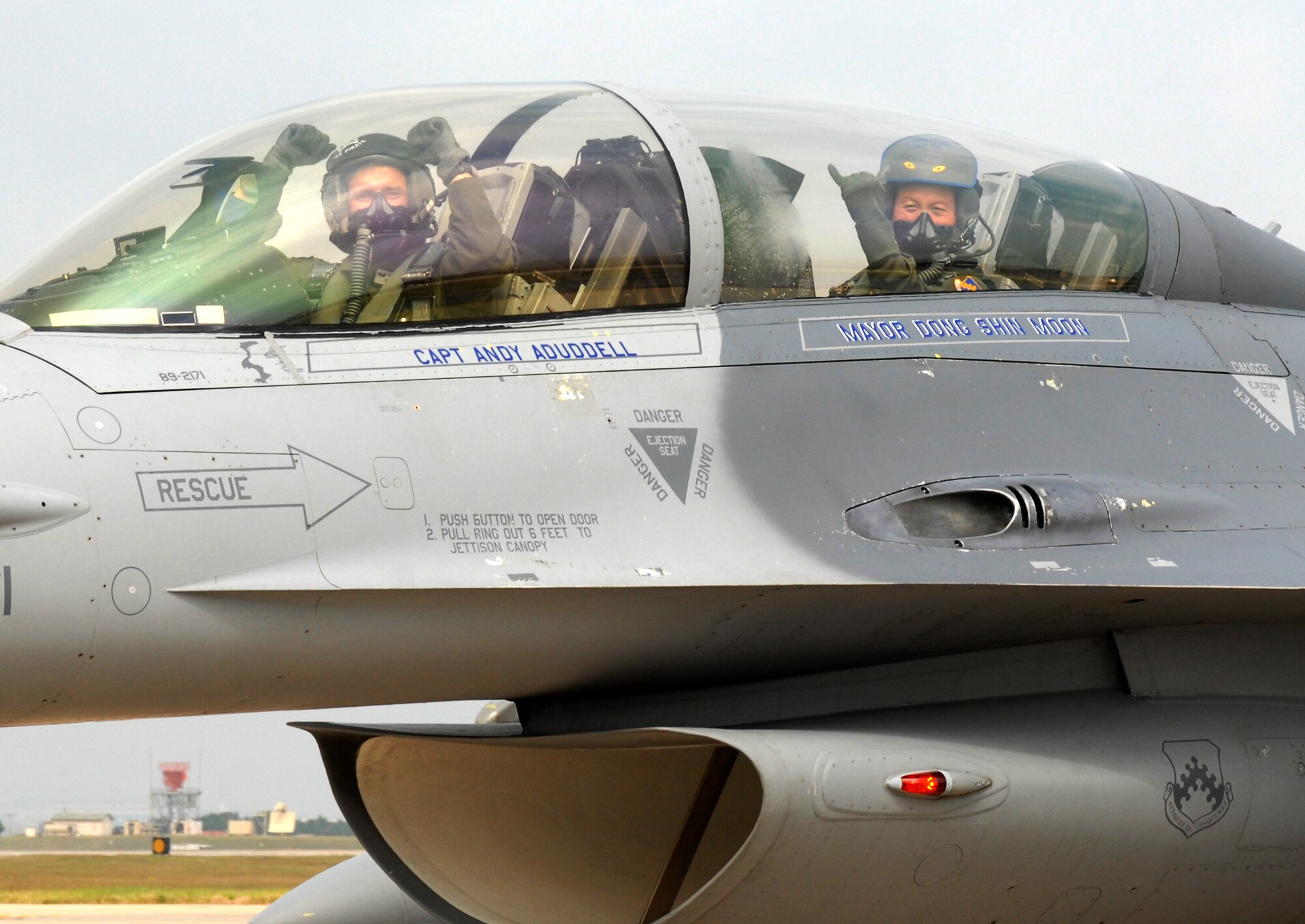 Colonel Bryan "Wolf" Bearden, 8th Fighter Wing commander and Dong Shin Moon, Gunsan City Mayor, taxi down the runway at Kunsan Air Base, Republic of Korea, Sept. 23. Mayor Moon received a high-speed taxi ride as a particpant in the base's Pilot for a Day program which is part of USFK's Good Neighbor Program.  (U.S. Air Force photo by Senior Airman Gustavo Gonzalez)