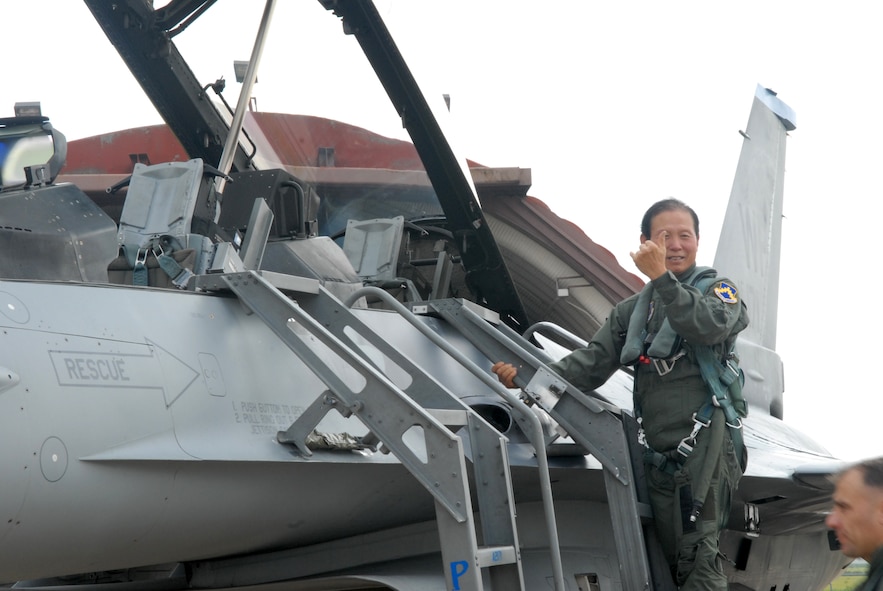 Gunsan City Mayor Dong Shin Moon exits an F-16 after his high-speed taxi ride at Kunsan Air Base, Republic of Korea Sept. 23. Mayor Moon was participating in the Pilot for a Day program which is part of USFK's Good Neighbor Program.(U.S. Air Force photo by: Senior Airman Angela Ruiz)